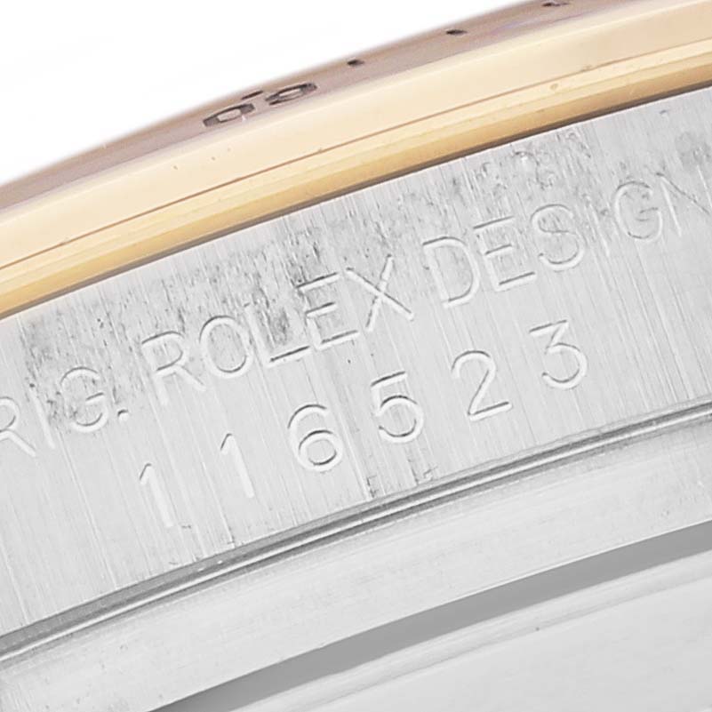 The image shows a close-up of the serial number and engraving on the casing of a Rolex Daytona 116523 Men's Steel and Gold (two tone) Mother of Pearl Dial 116523 Men's Steel and Gold (two tone) Mother of Pearl Dial watch.