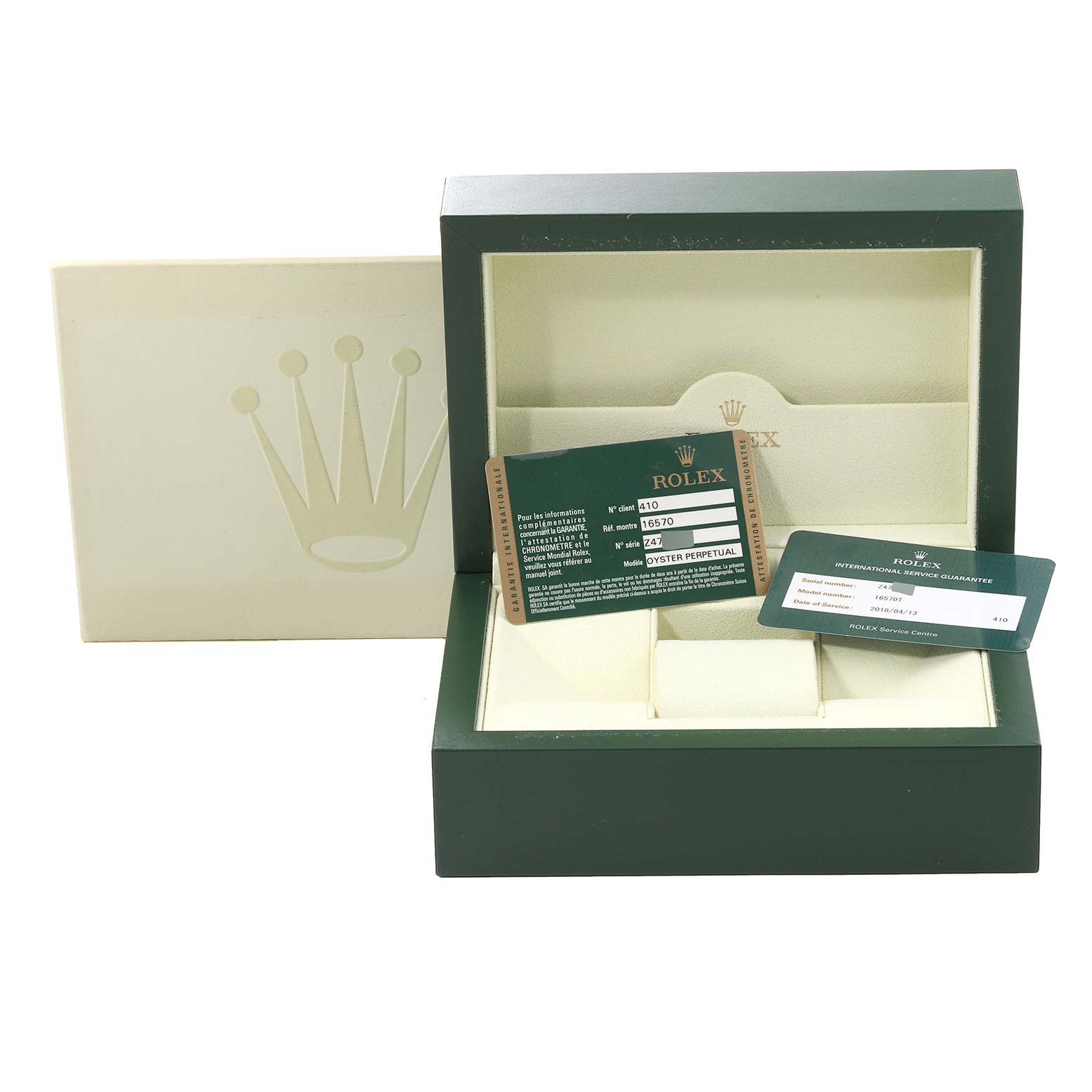 The image shows the open box and warranty cards for the Rolex Explorer 16570 Men
s Stainless Steel Black Dial 16570 Men
s Stainless Steel Black Dial model, with the lid and guarantee cards visible.