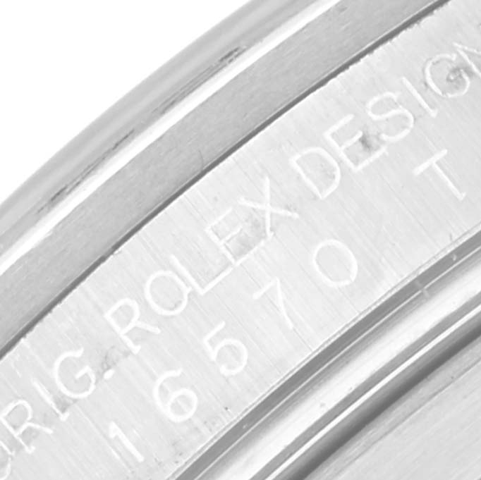 This close-up angle shows the engraved model number and "Rolex Design" mark on the bezel of the Rolex Explorer 16570 Men
s Stainless Steel Black Dial 16570 Men
s Stainless Steel Black Dial watch.