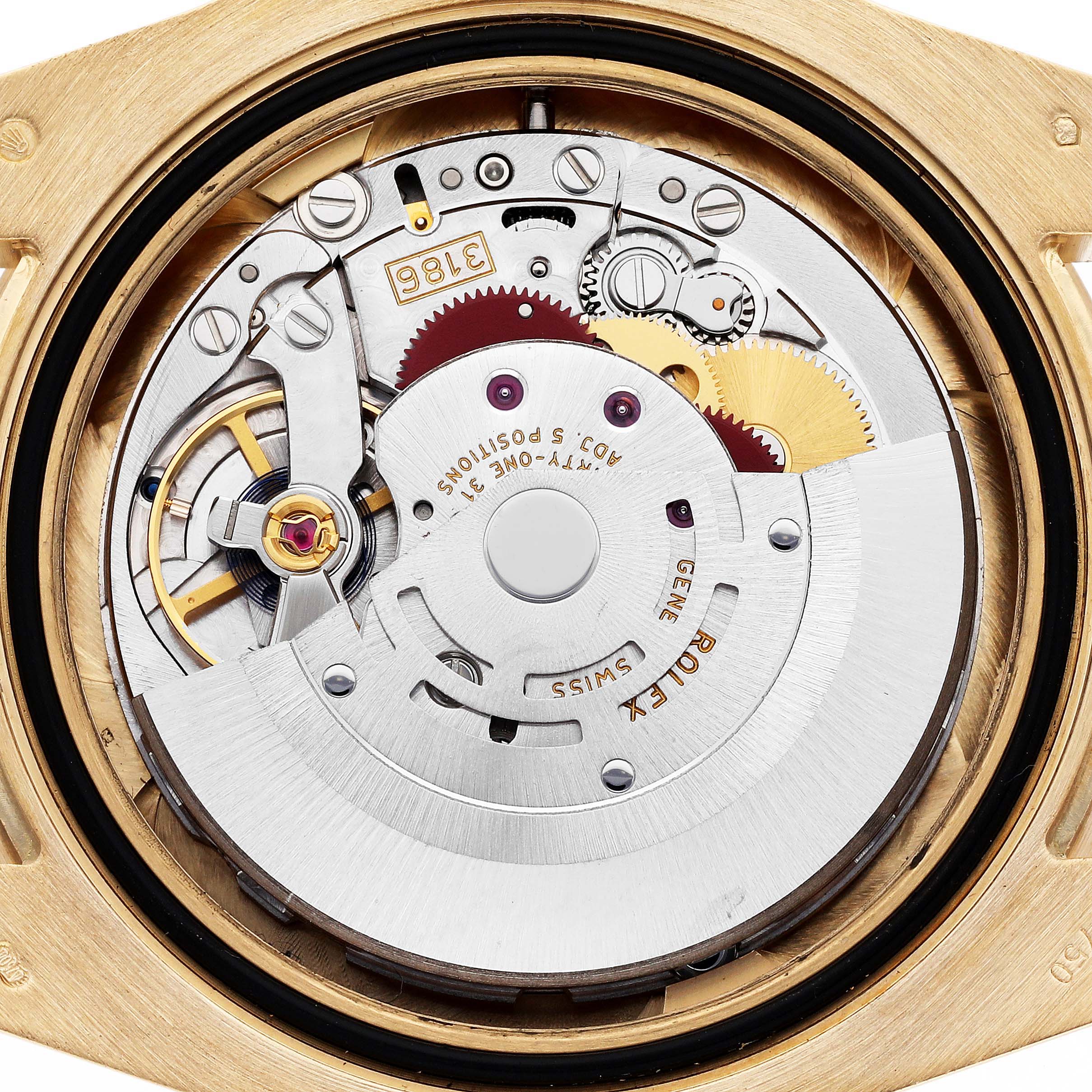 The image shows the movement of a Rolex GMT-Master 116718LN Men's Yellow Gold Green Dial 116718LN Men's Yellow Gold Green Dial watch from a top-down angle, revealing intricate gears and mechanisms.