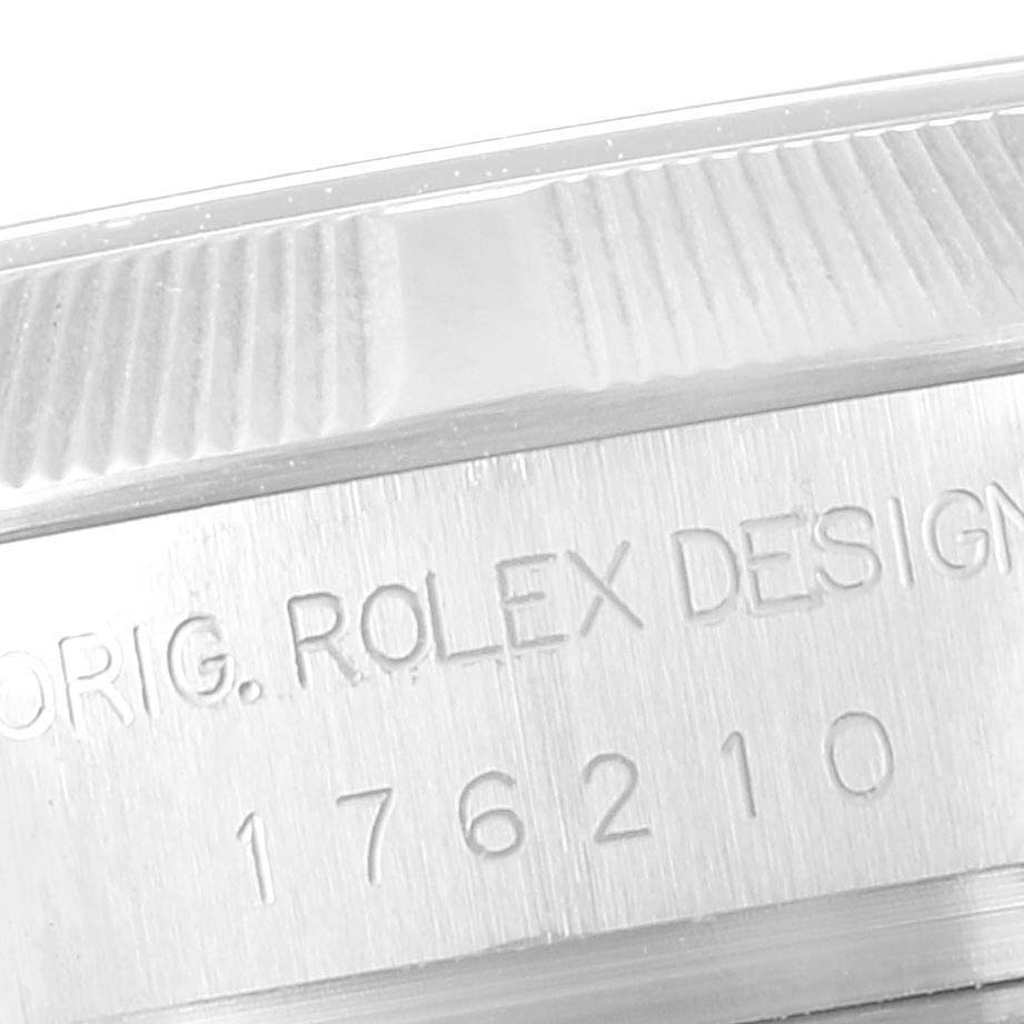 This close-up angle shows the engraved side of the bezel and case of the Rolex Oyster Perpetual 176210 Women's Stainless Steel White Dial 176210 Women's Stainless Steel White Dial watch.