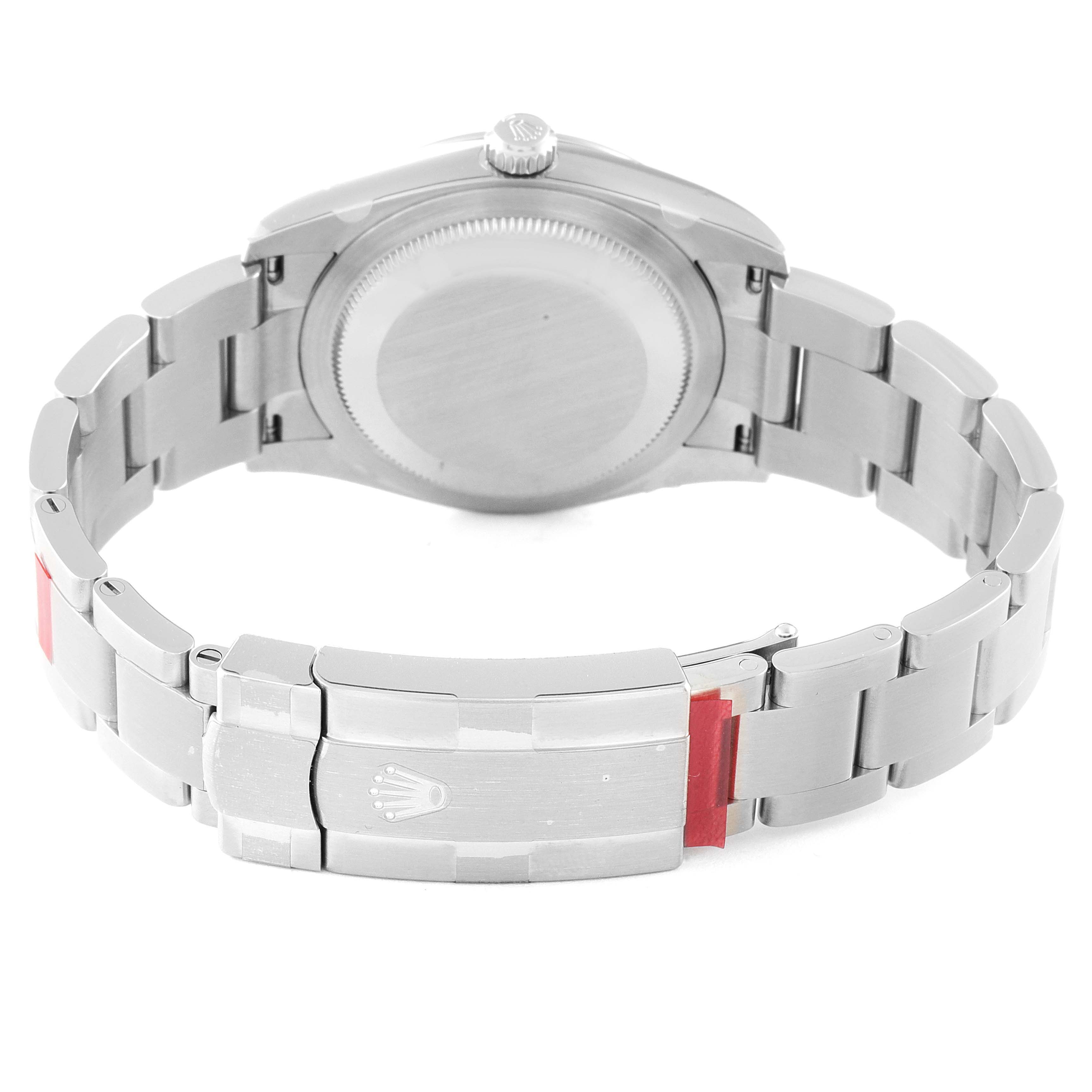 The image shows the back view of a Rolex Oyster Perpetual 124200 Men
s Stainless Steel Blue Dial 124200 Men
s Stainless Steel Blue Dial watch, including the closed clasp and part of the bracelet.