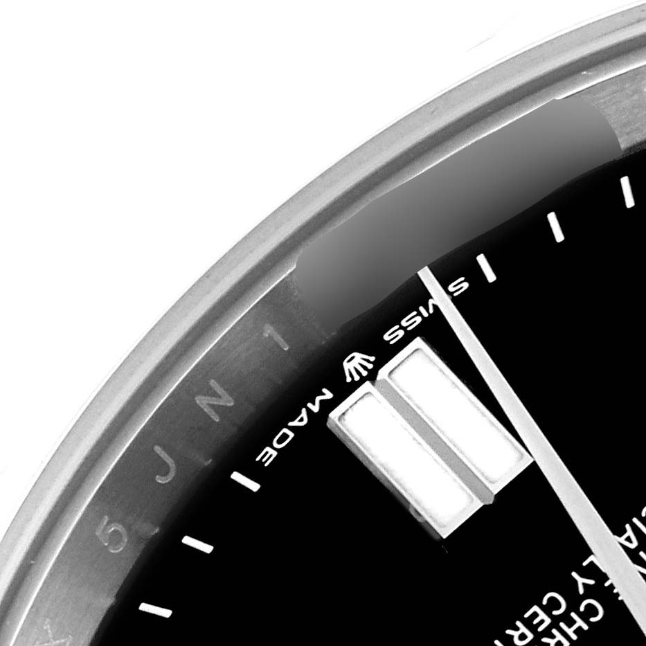 The image shows a close-up of a Rolex Oyster Perpetual 124300 Men
s Stainless Steel Black Dial 124300 Men
s Stainless Steel Black Dial watch, focusing on the dial edge, indices, and the "Swiss Made" marking.
