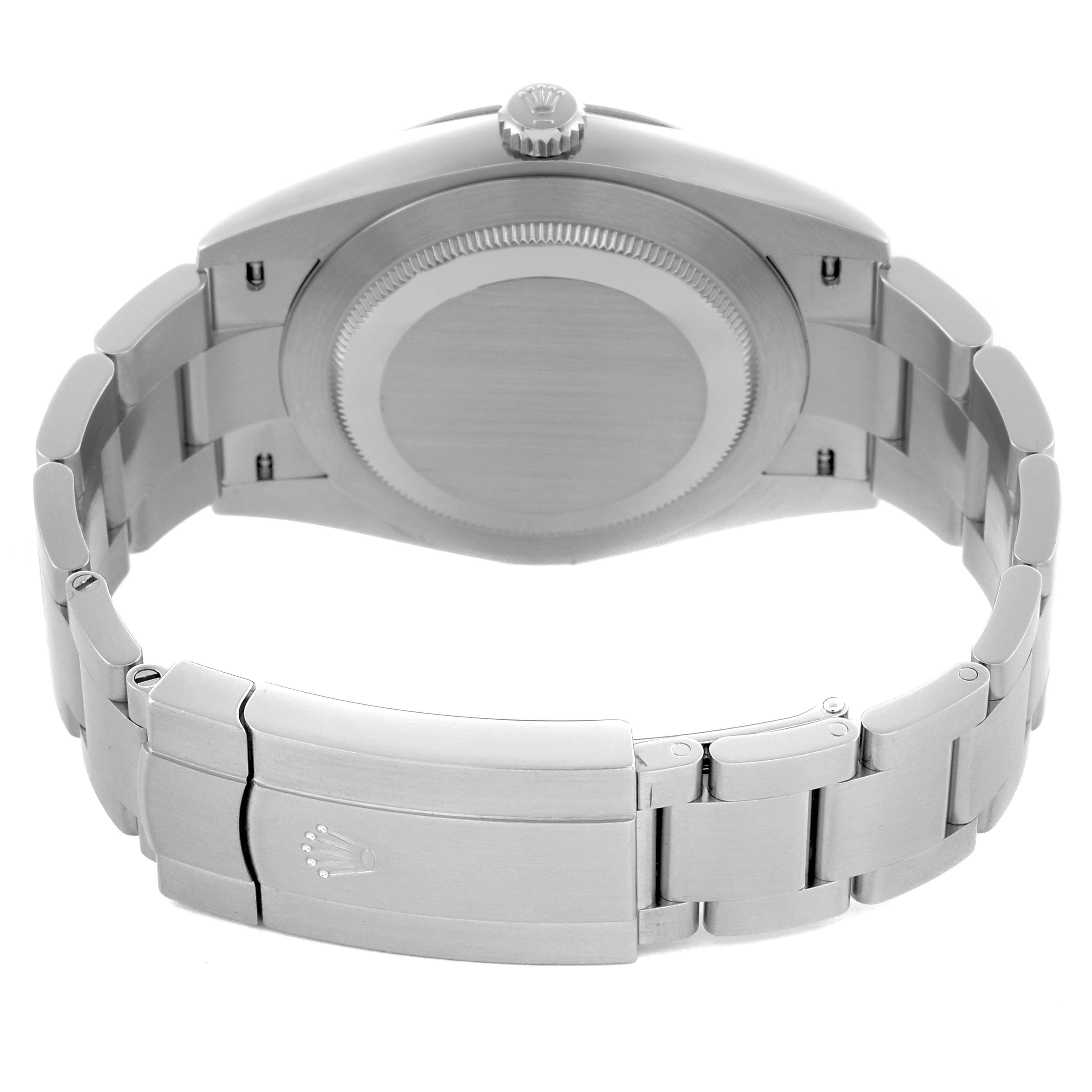 The image shows the back case and bracelet of the Rolex Oyster Perpetual 124300 Men
s Stainless Steel Black Dial 124300 Men
s Stainless Steel Black Dial, highlighting the clasp and crown.