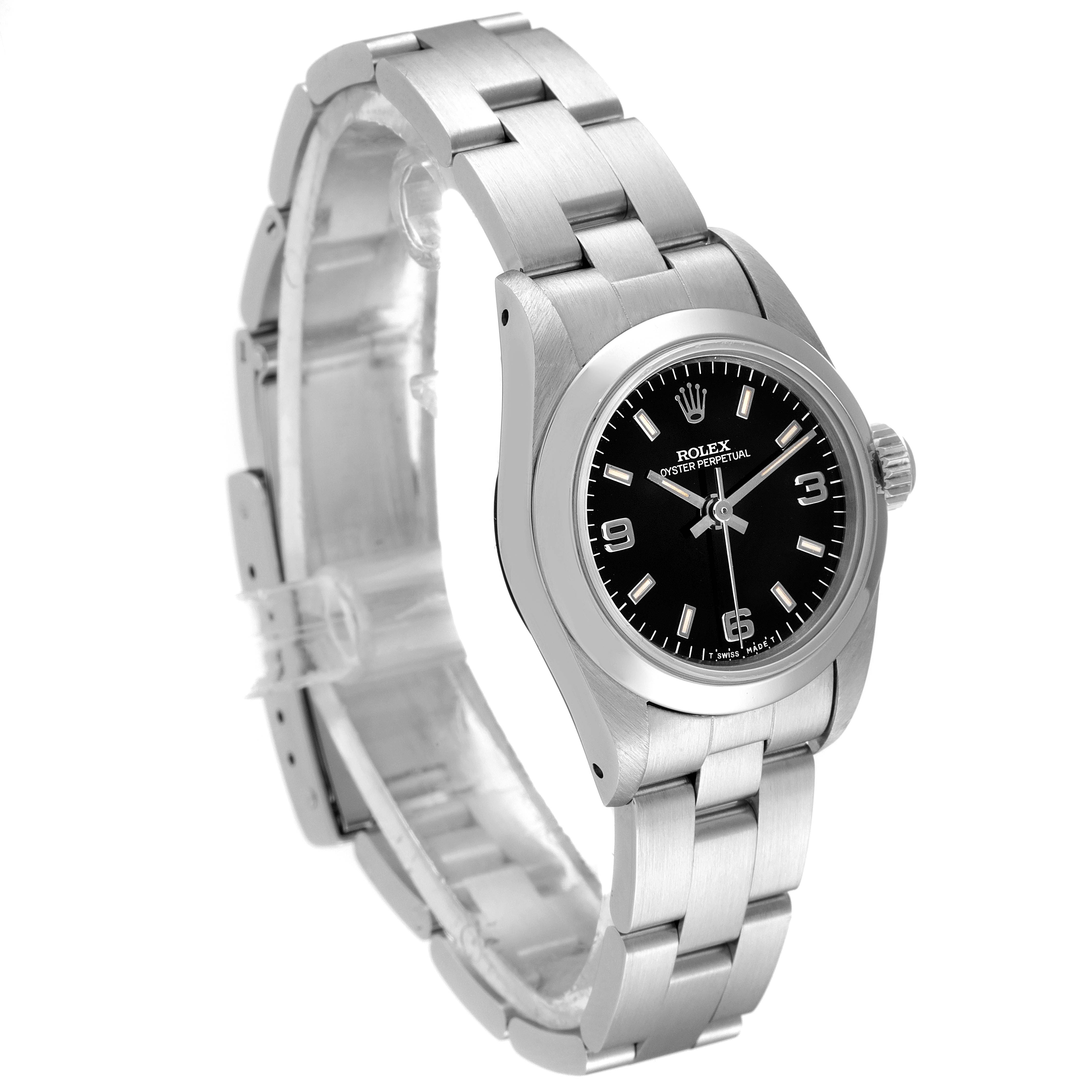 This image shows a Rolex Oyster Perpetual 67180 Women's Stainless Steel Black Dial 67180 Women's Stainless Steel Black Dial watch at an angle, highlighting the black dial, bezel, and bracelet.