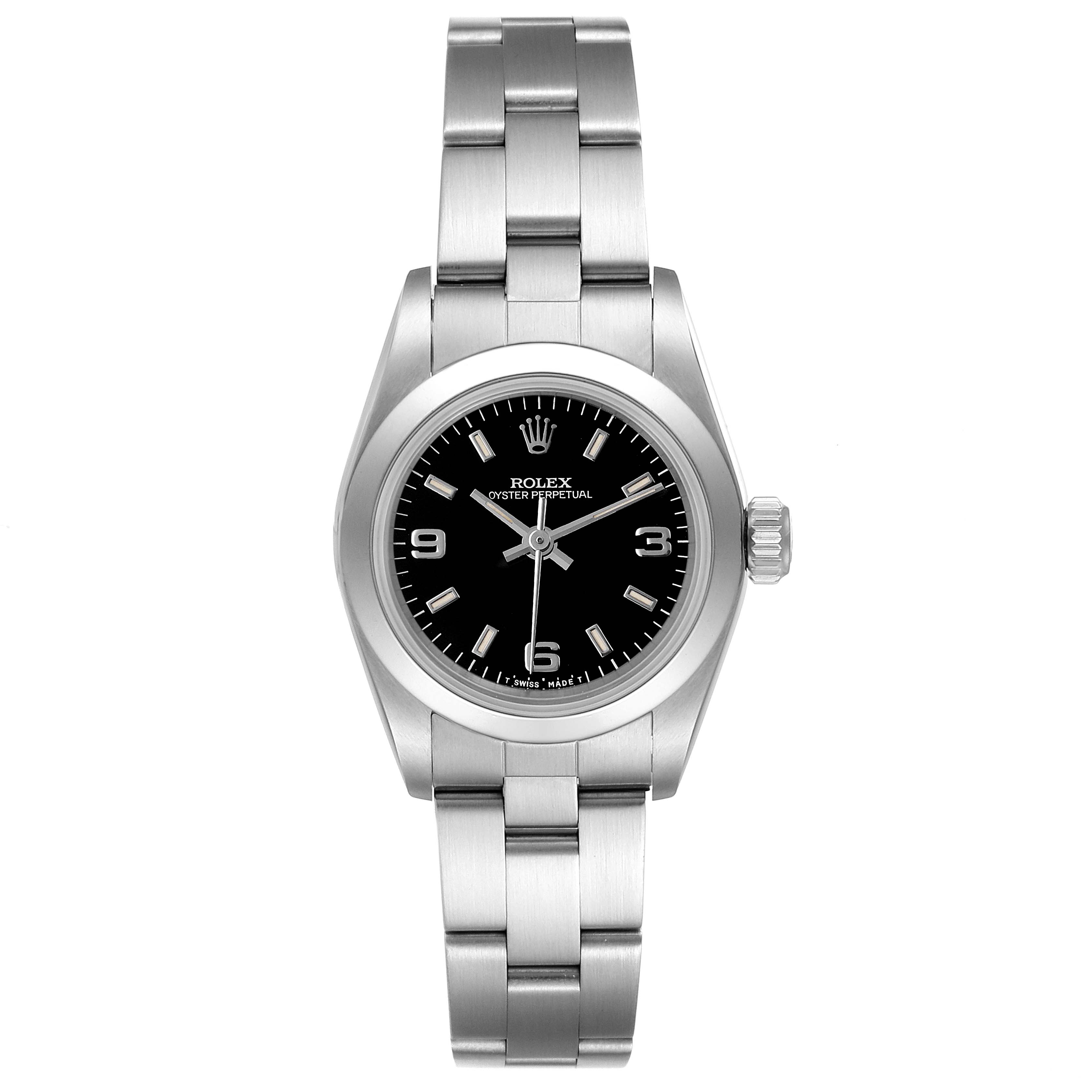 The image shows a front view of a Rolex Oyster Perpetual 67180 Women's Stainless Steel Black Dial 67180 Women's Stainless Steel Black Dial watch, featuring its bracelet, black dial, and crown.