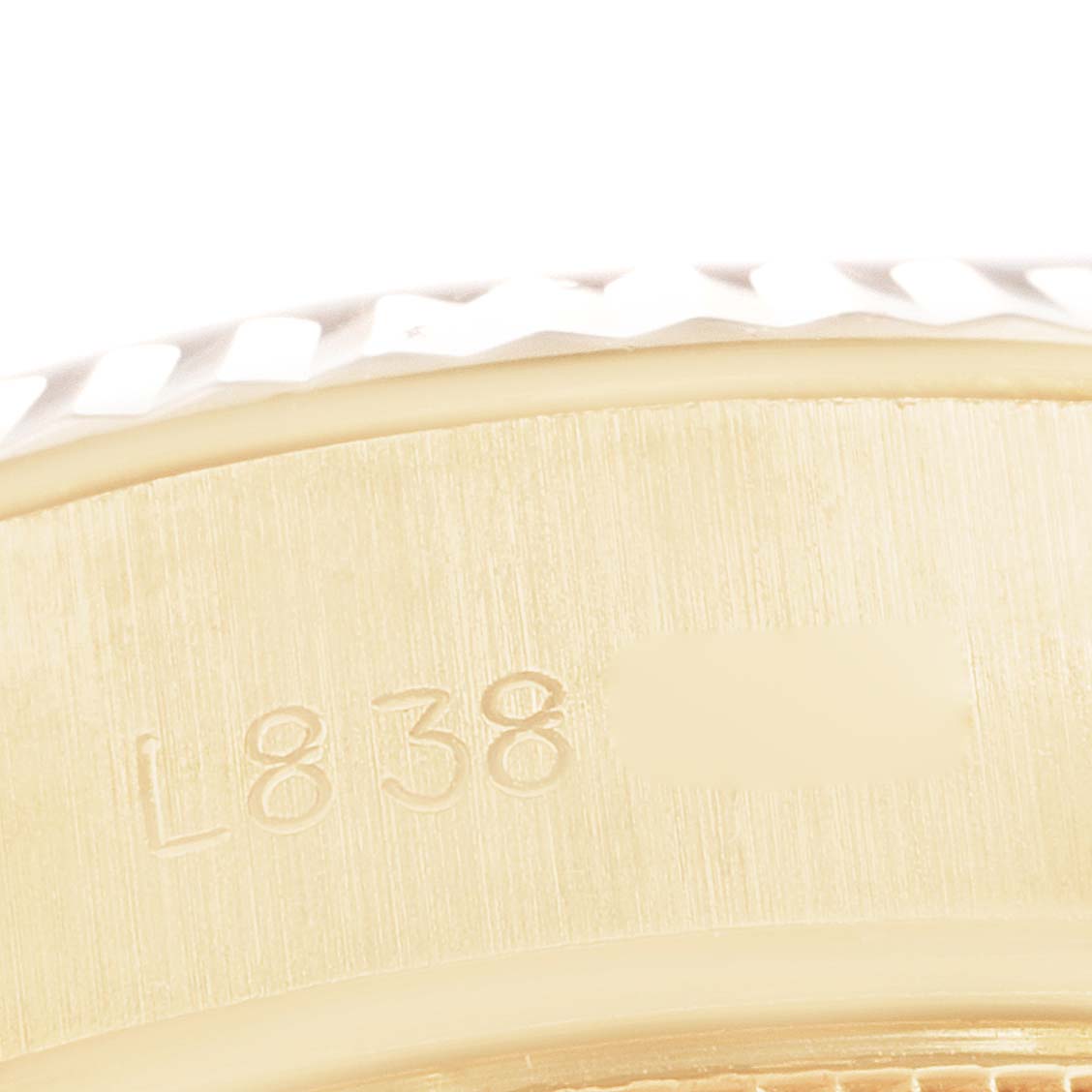 The image shows a close-up view of the engraved case back and fluted bezel of a Rolex President 69178 Women's Yellow Gold Blue Dial 69178 Women's Yellow Gold Blue Dial model watch.