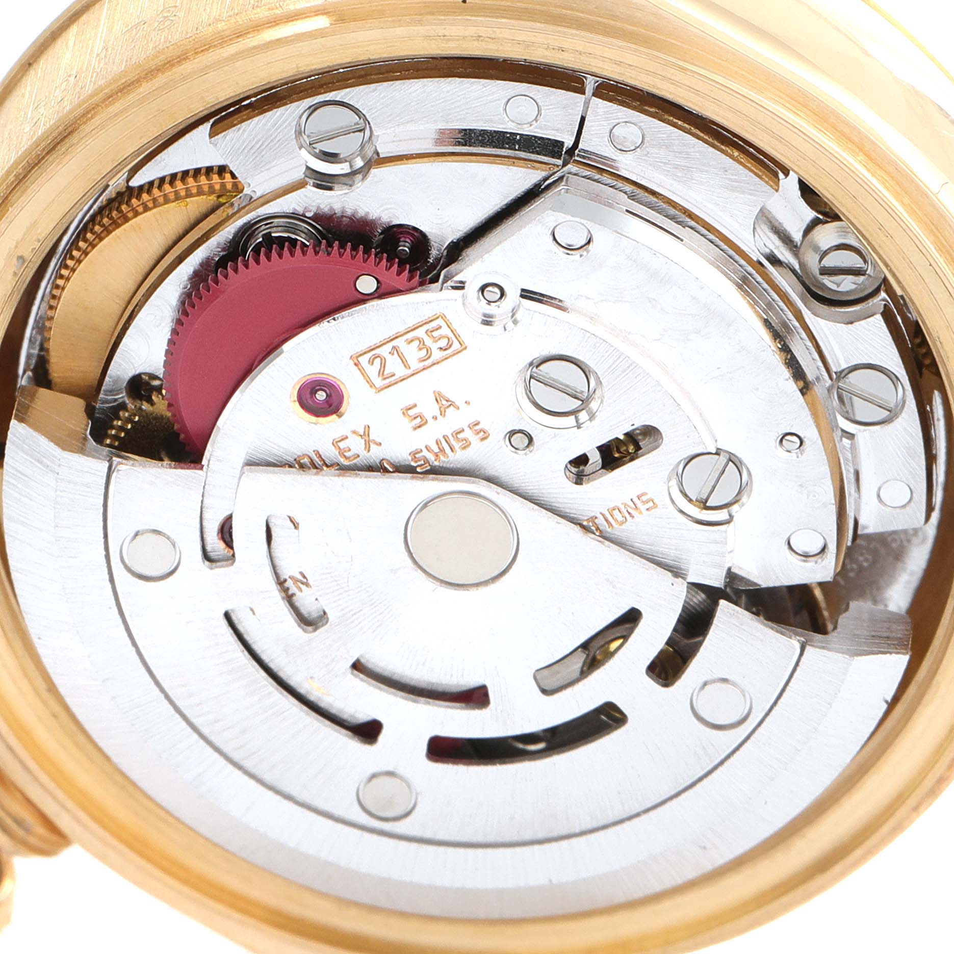 The image shows the inner mechanical movement of the Rolex President 69178 Women
s Yellow Gold Champagne Dial 69178 Women
s Yellow Gold Champagne Dial model from a close-up angle, highlighting gears and intricate parts.