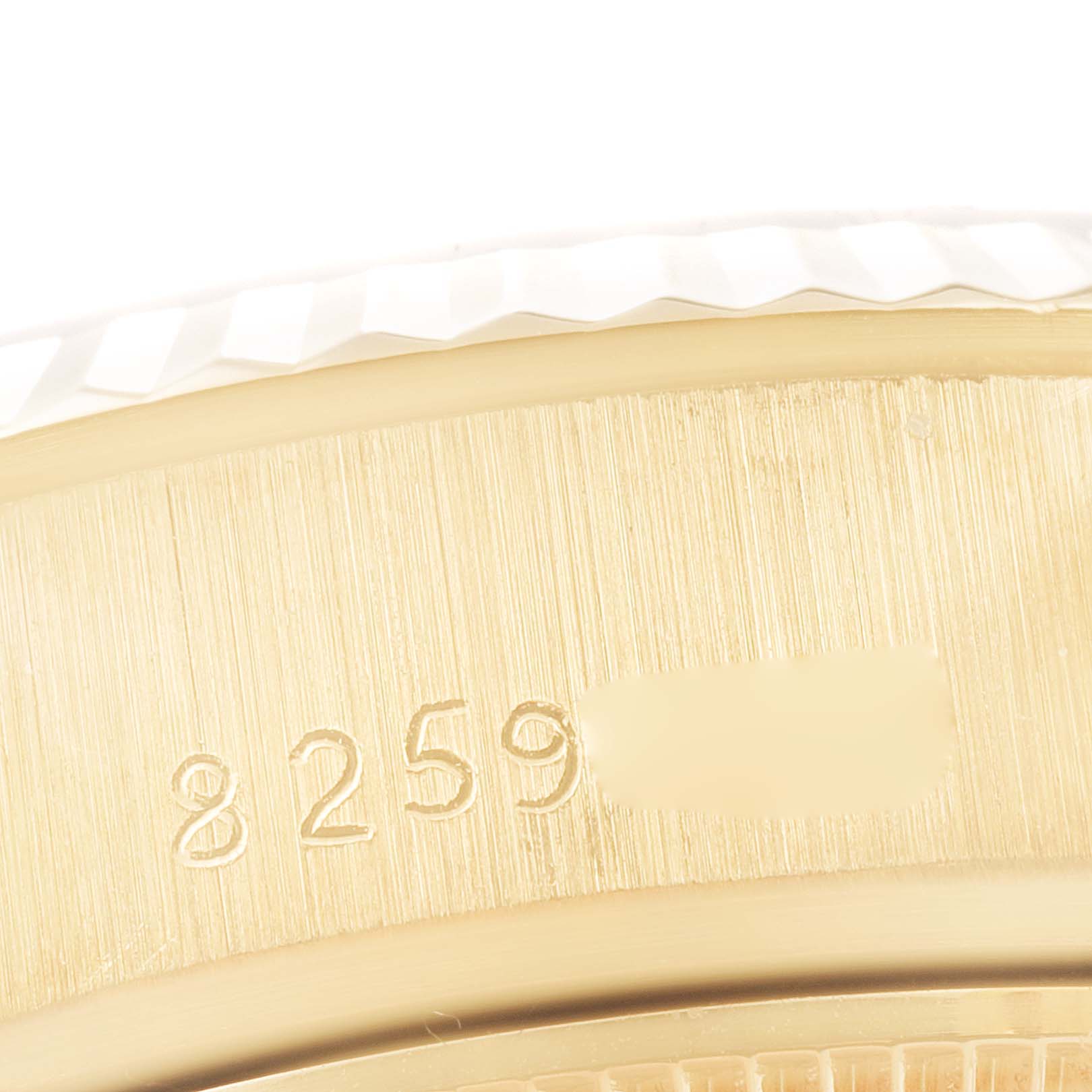 This is a close-up of the serial number engraving on the case of a Rolex President 69178 Women
s Yellow Gold Champagne Dial 69178 Women
s Yellow Gold Champagne Dial model watch.
