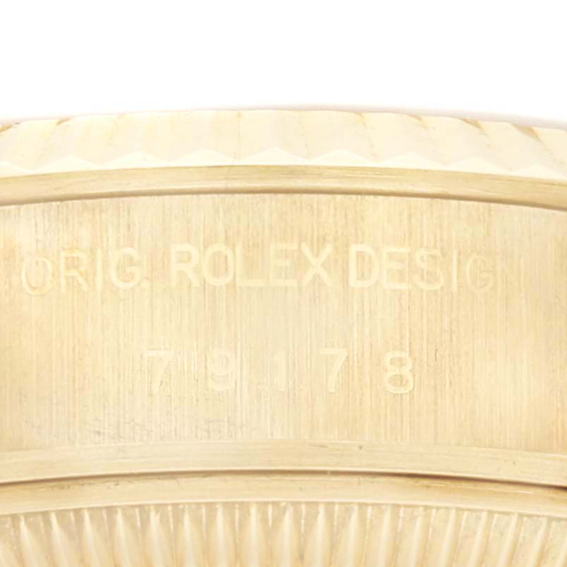 The image shows a close-up of the Rolex President 79178 Women
s Yellow Gold Champagne Dial 79178 Women
s Yellow Gold Champagne Dial watch
s case side, displaying the model number and "ORIG. ROLEX DESIGN."