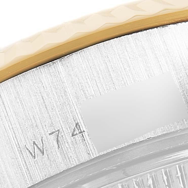 This close-up image shows the engraved serial number on the side of the Rolex President 69179 Women's White Gold Brown Dial 69179 Women's White Gold Brown Dial model.