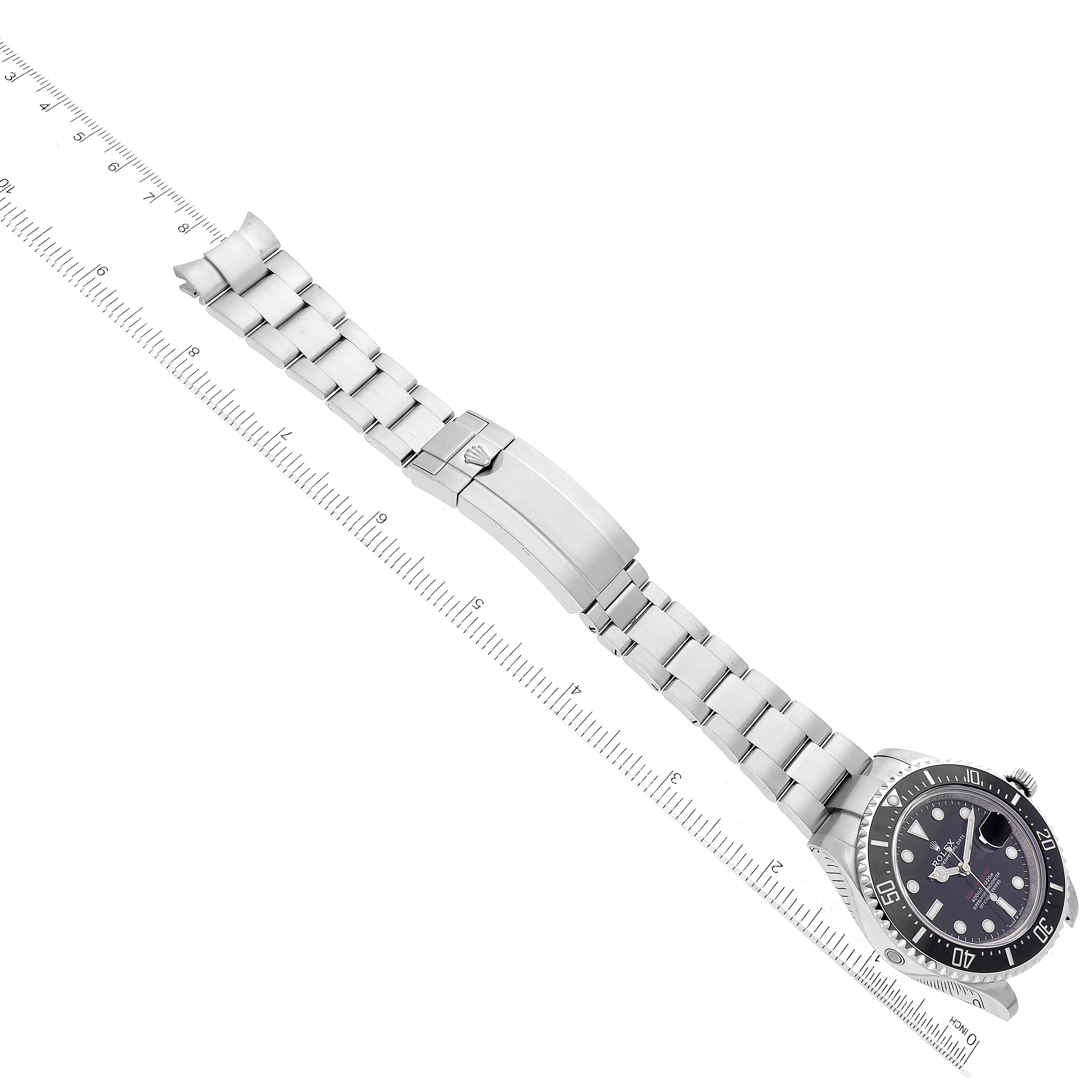 This image shows a Rolex Sea-Dweller 126600 Men
s Stainless Steel Black Dial 126600 Men
s Stainless Steel Black Dial watch laid flat, displaying the dial, bezel, bracelet, and clasp from a top-down angle.