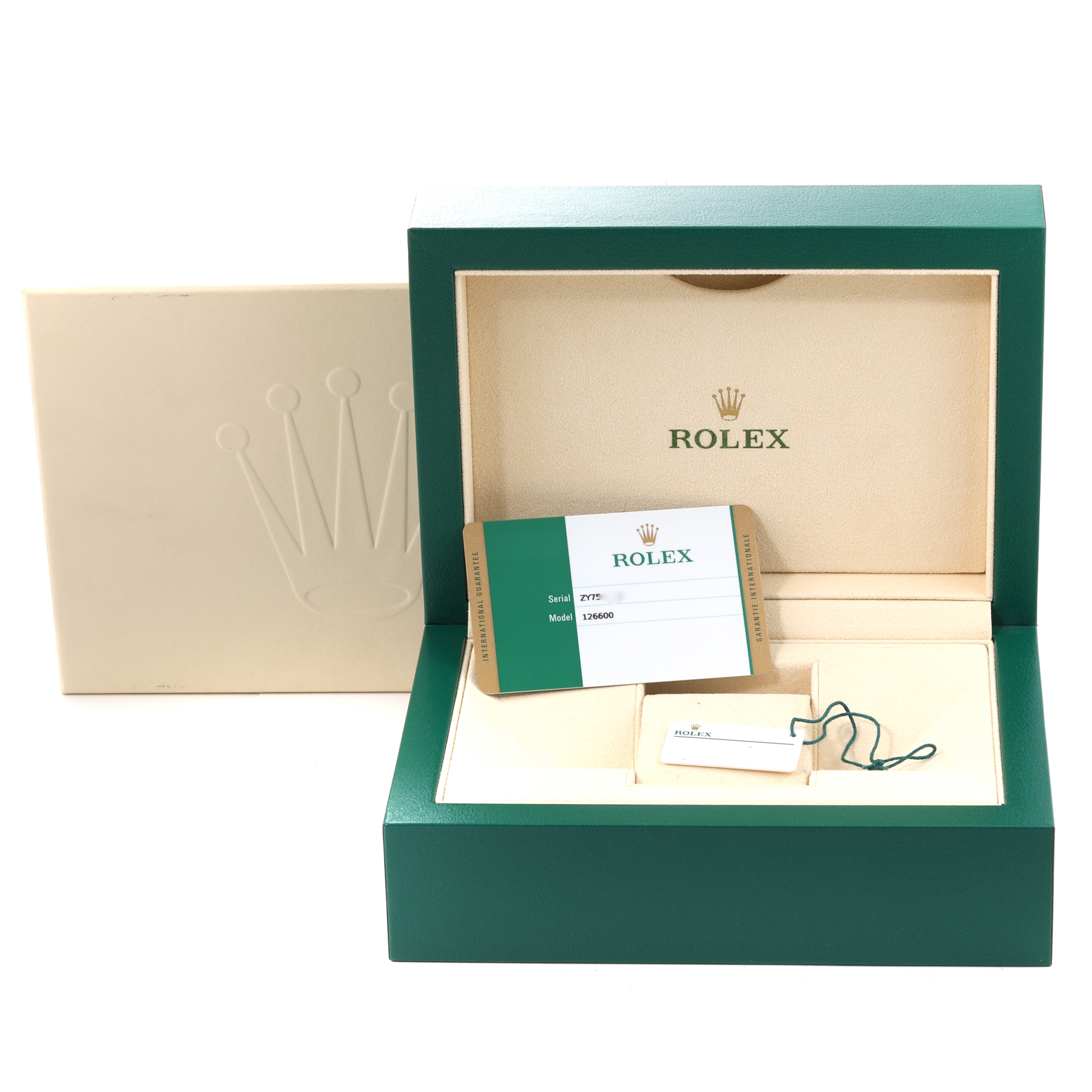 The image shows the open box and accessories for a Rolex Sea-Dweller 126600 Men
s Stainless Steel Black Dial 126600 Men
s Stainless Steel Black Dial watch, including the warranty card and tag.