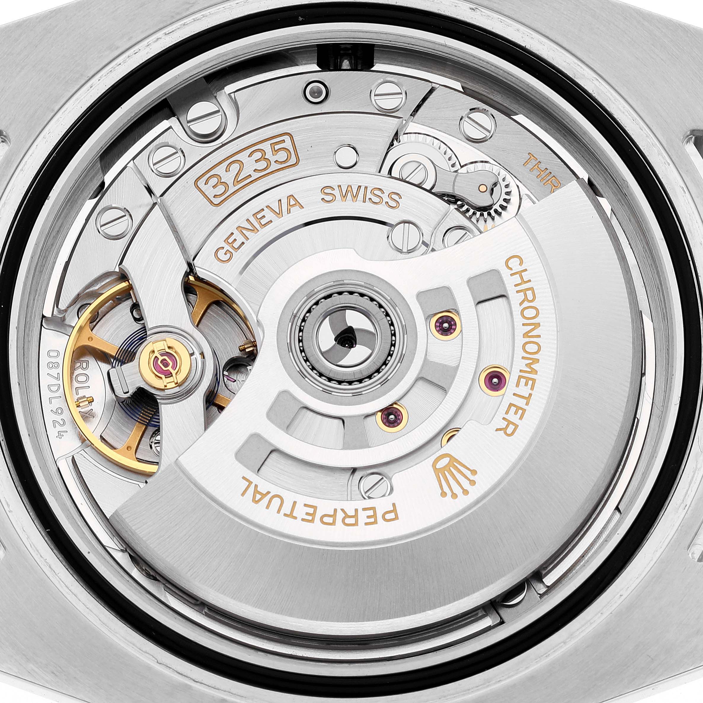 This image shows a close-up of the movement and mechanism of a Rolex Submariner 126613LB Men
s Steel and Gold (two tone) Blue Dial 126613LB Men
s Steel and Gold (two tone) Blue Dial watch, specifically the 3235 caliber.