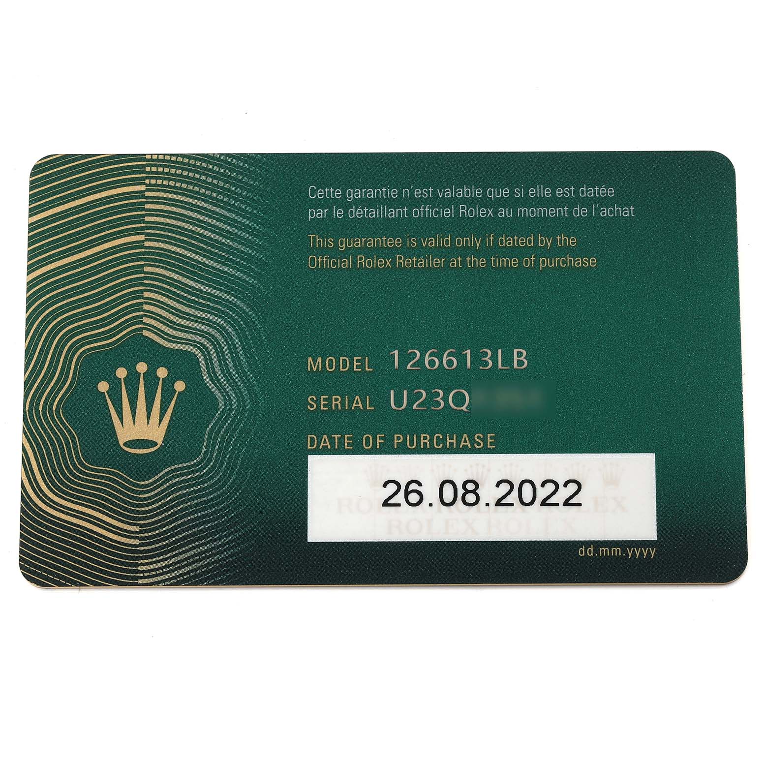 This image shows the warranty card for the Rolex Submariner 126613LB Men
s Steel and Gold (two tone) Blue Dial 126613LB Men
s Steel and Gold (two tone) Blue Dial model 126613LB, including the serial number and date of purchase.