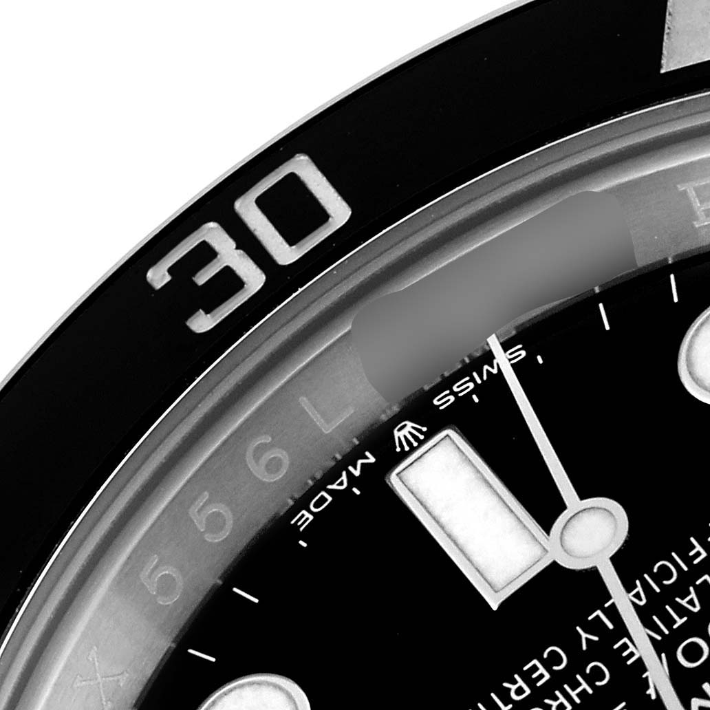 This close-up image of the Rolex Submariner 126610LN Men
s Stainless Steel Black Dial 126610LN Men
s Stainless Steel Black Dial shows a portion of its black bezel with the number "30" and part of the dial with hour markers and hands.