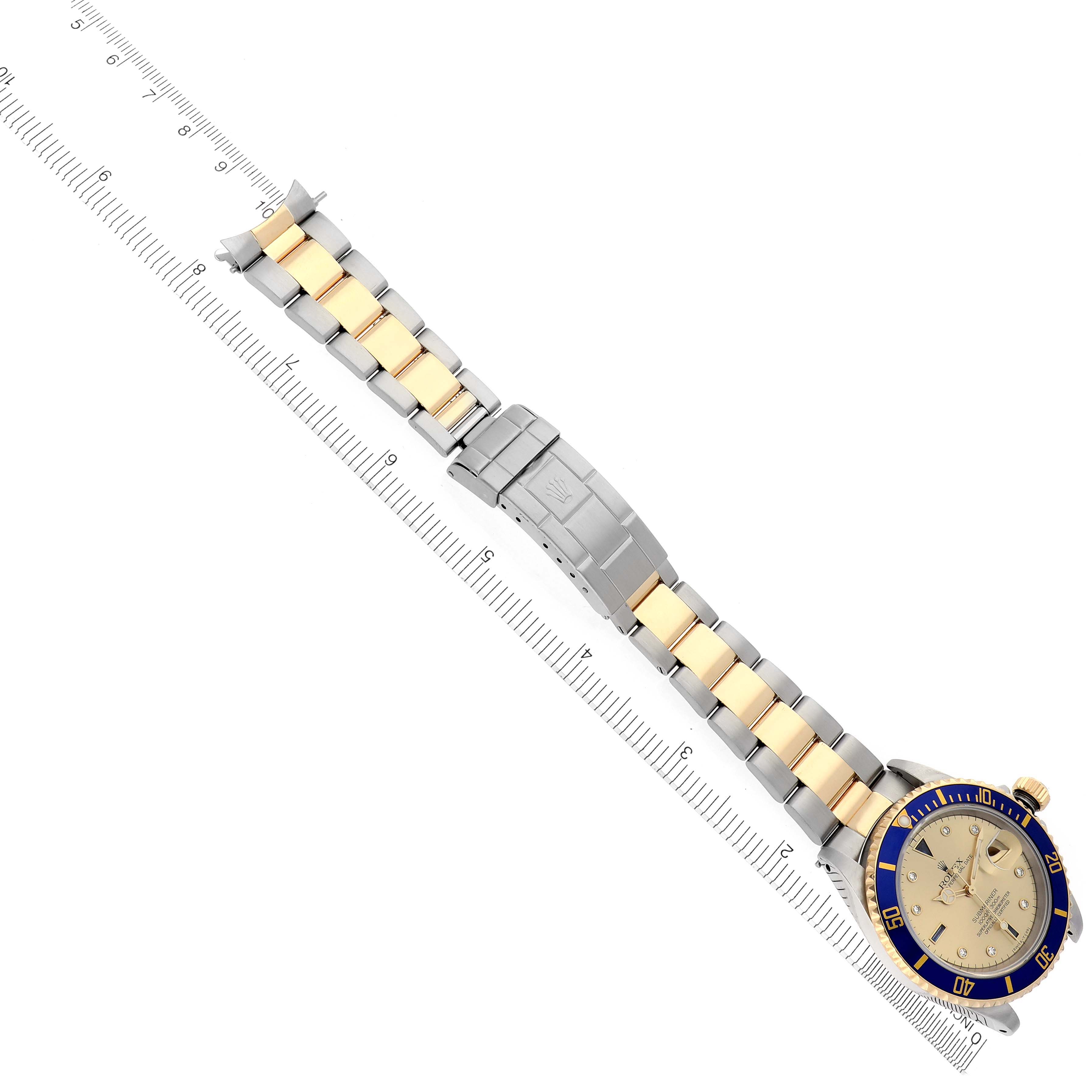 The Rolex Submariner 16613 Men's Steel and Gold (two tone) Champagne Dial 16613 Men's Steel and Gold (two tone) Champagne Dial is shown diagonally, displaying the two-tone bracelet and the face with bezel and markings.