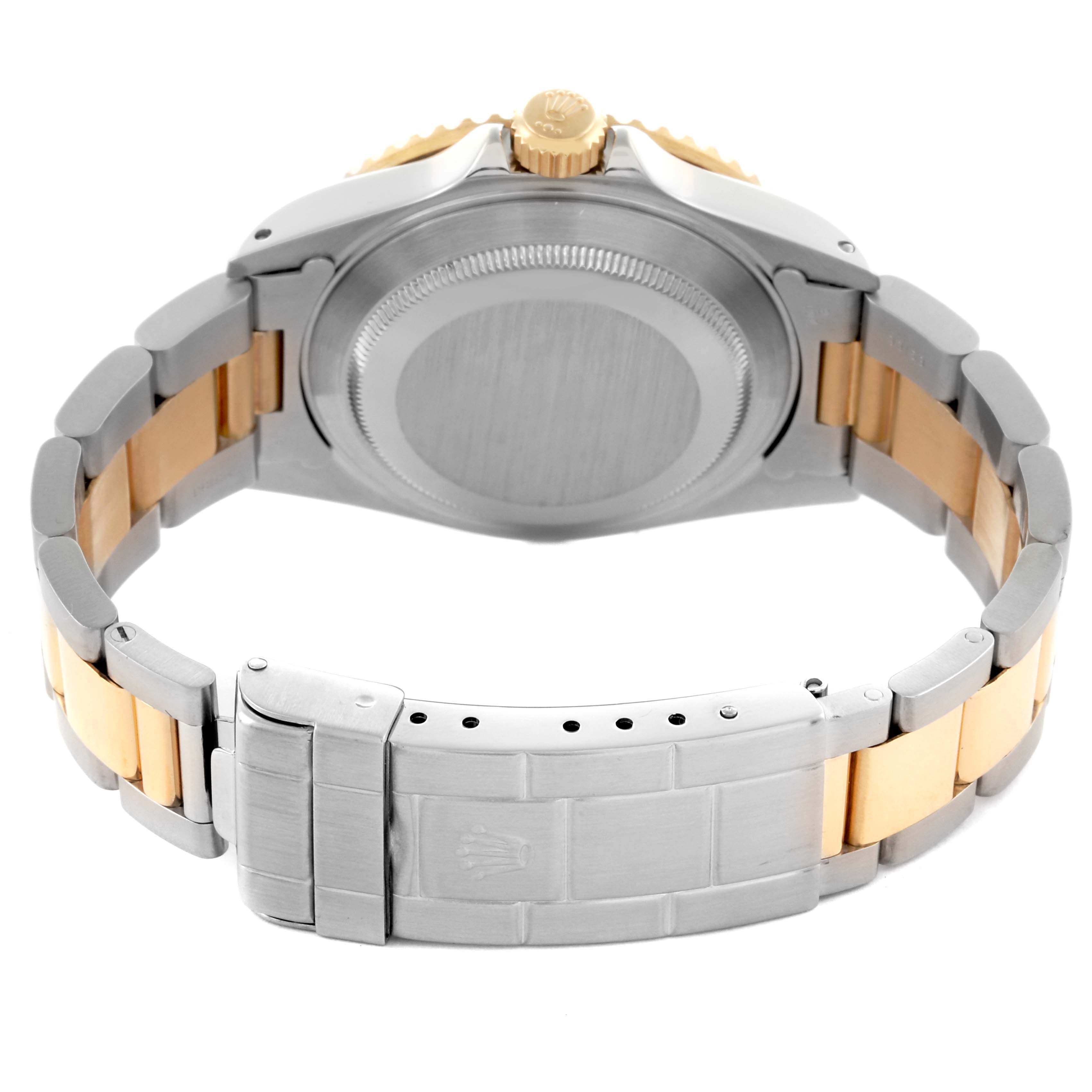 The image shows a rear view of the Rolex Submariner 16613 Men's Steel and Gold (two tone) Champagne Dial 16613 Men's Steel and Gold (two tone) Champagne Dial, highlighting the caseback, bracelet, and clasp.