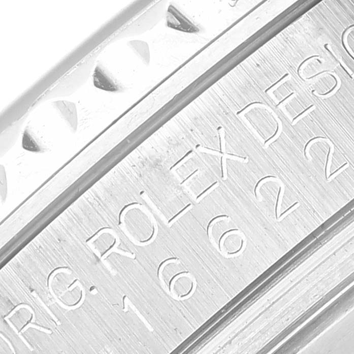 This is a close-up image of the engraving on the bezel and case of a Rolex Yacht-Master 16622 Men's Stainless Steel Silver Dial 16622 Men's Stainless Steel Silver Dial watch.