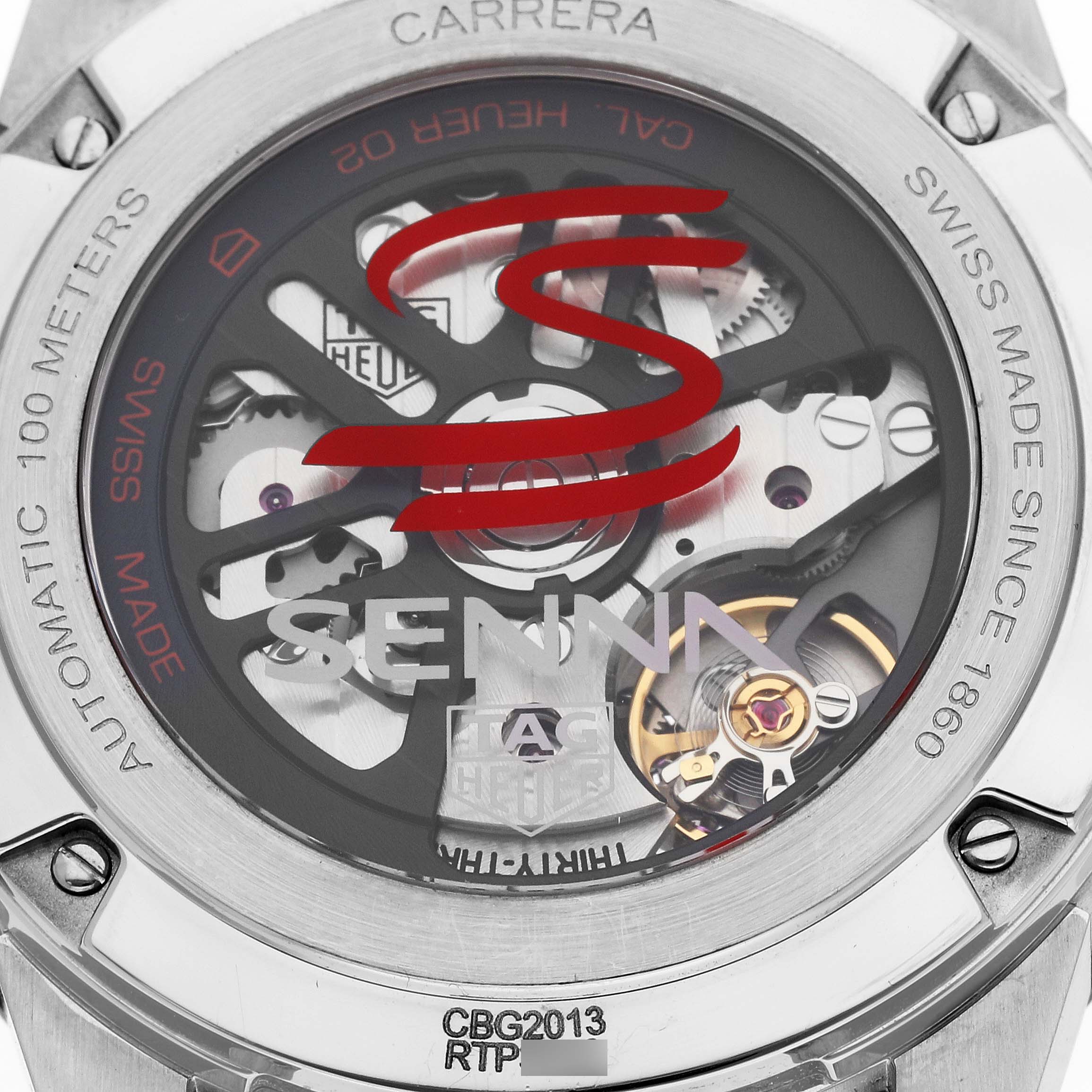 The image shows the back view of a Tag Heuer Carrera CBG2013.BA0657 Men's Stainless Steel Black Dial CBG2013.BA0657 Men's Stainless Steel Black Dial watch, highlighting its internal mechanics and "Senna" branding.