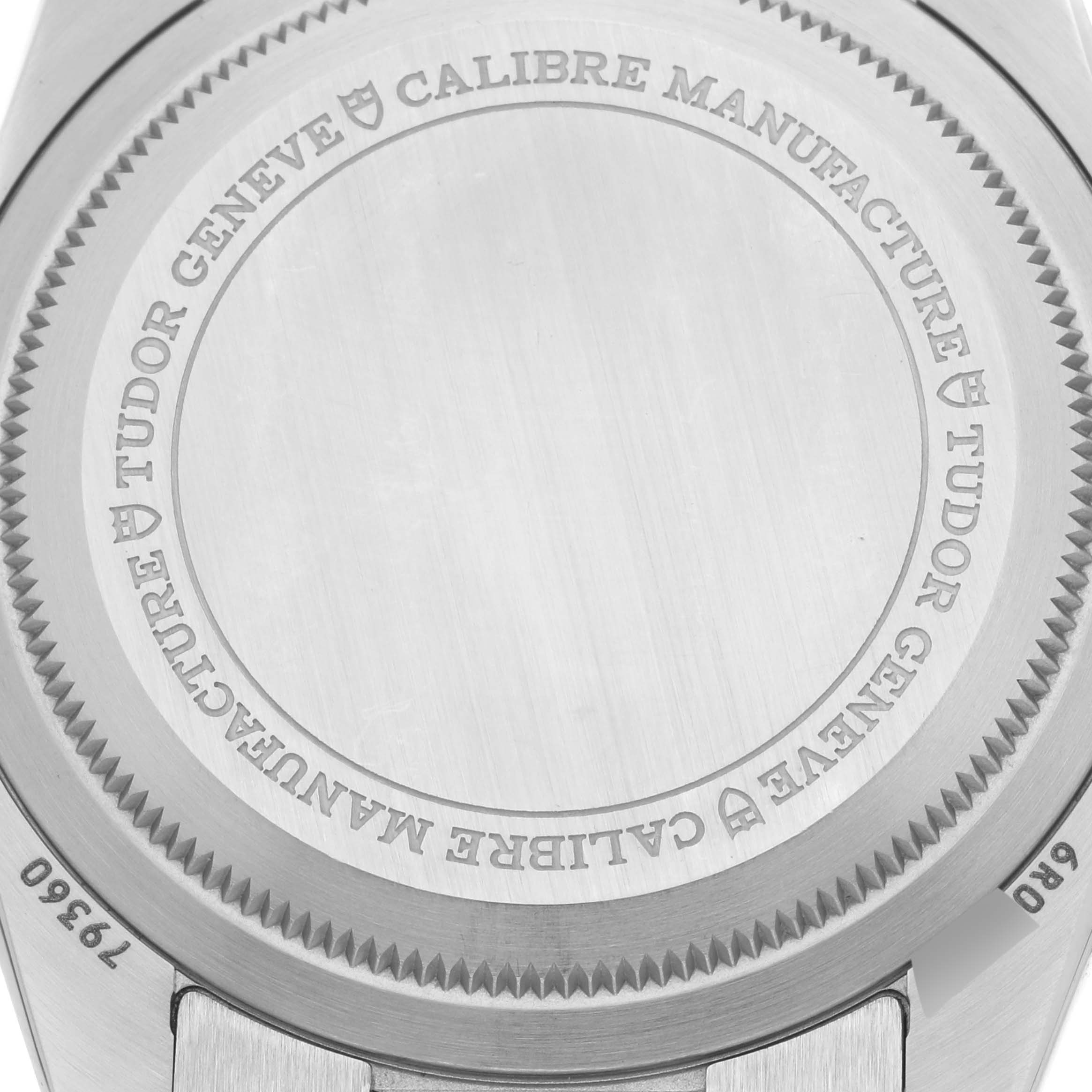 The image shows the case back of the Tudor Heritage Chrono 79360N-0001 Men's Stainless Steel Black Dial 79360N-0001 Men's Stainless Steel Black Dial, highlighting engravings and its metal finish.