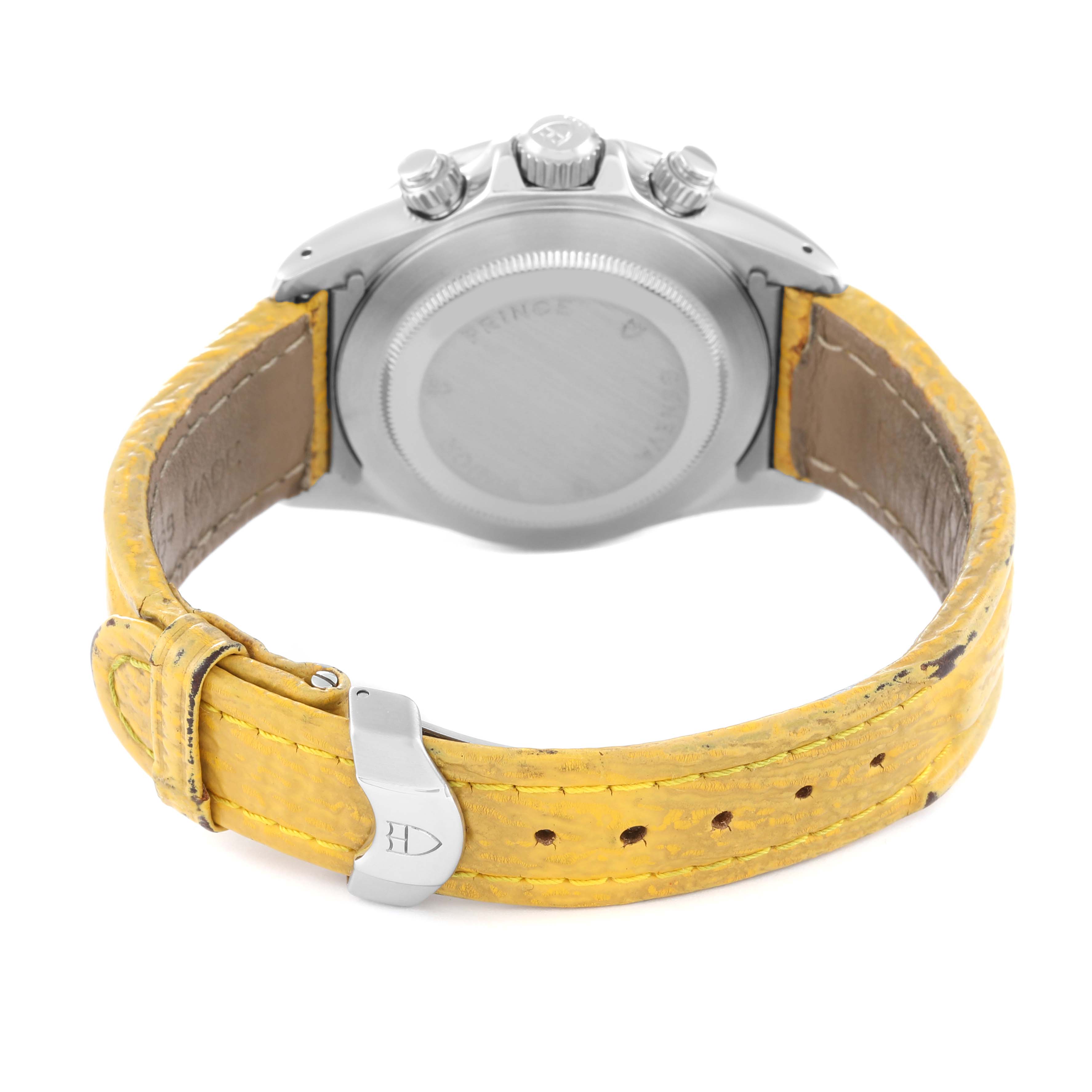 The image shows the back of the Tudor Prince watch, highlighting the case back, yellow leather strap, and clasp.