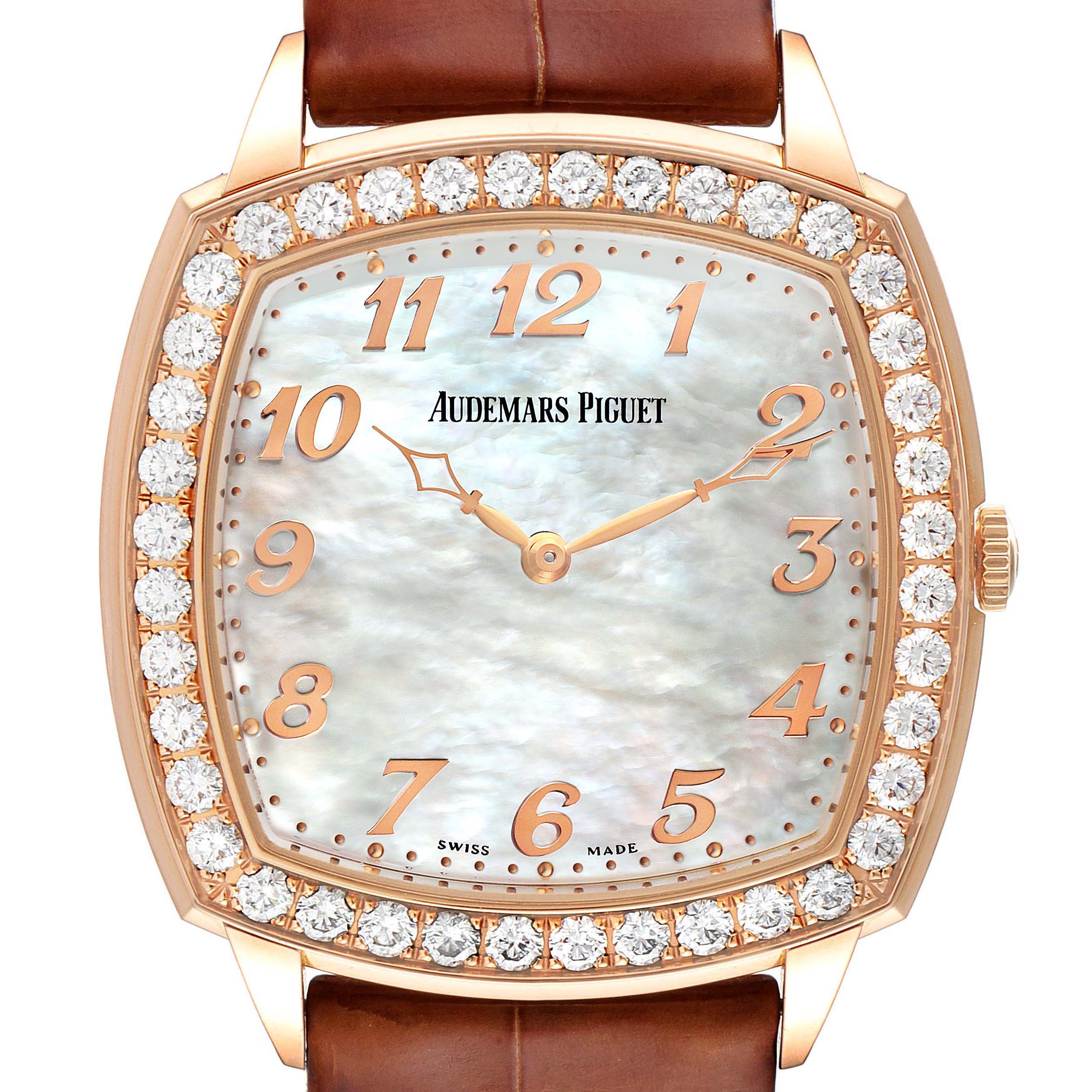 The image shows the face of a Vintage model Audemars Piguet watch with a diamond-studded bezel and a brown leather strap.