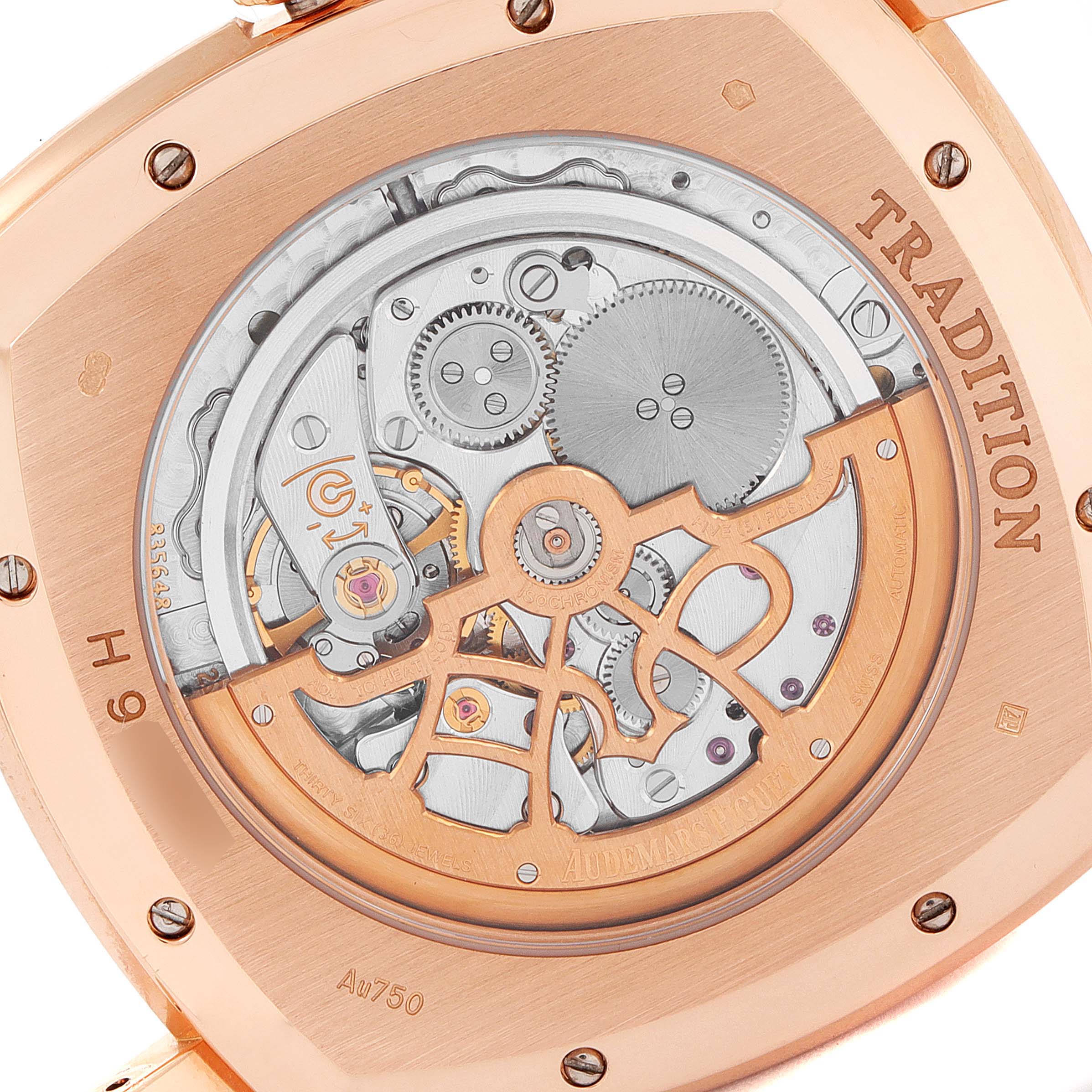 The image shows the back view of a Vintage Audemars Piguet watch, highlighting its intricate mechanical movement and rose gold casing.