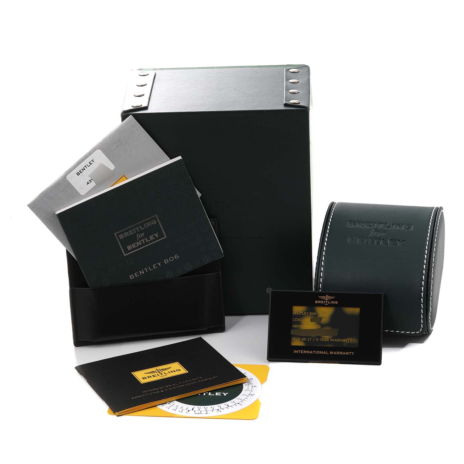 The image shows the packaging, warranty card, manuals, and a case for the Bentley model by Breitling.