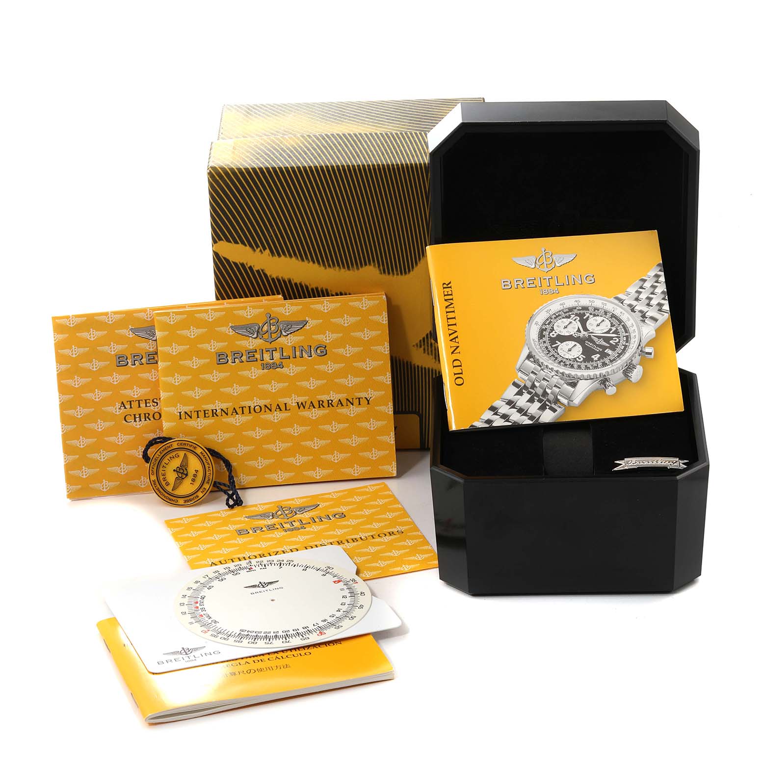 The image shows the Breitling Navitimer A13322 Men
s Stainless Steel Blue Dial A13322 Men
s Stainless Steel Blue Dial watch box, manuals, warranty cards, a hang tag, and related accessories from a top-side angle.