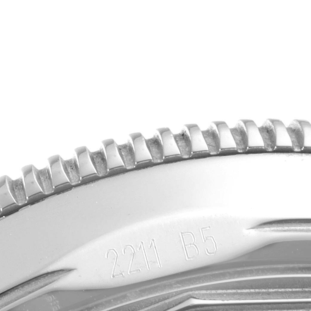 The image shows a close-up of the bezel and part of the case back of a Breitling Superocean A17321 Men's Stainless Steel Silver Dial A17321 Men's Stainless Steel Silver Dial watch.