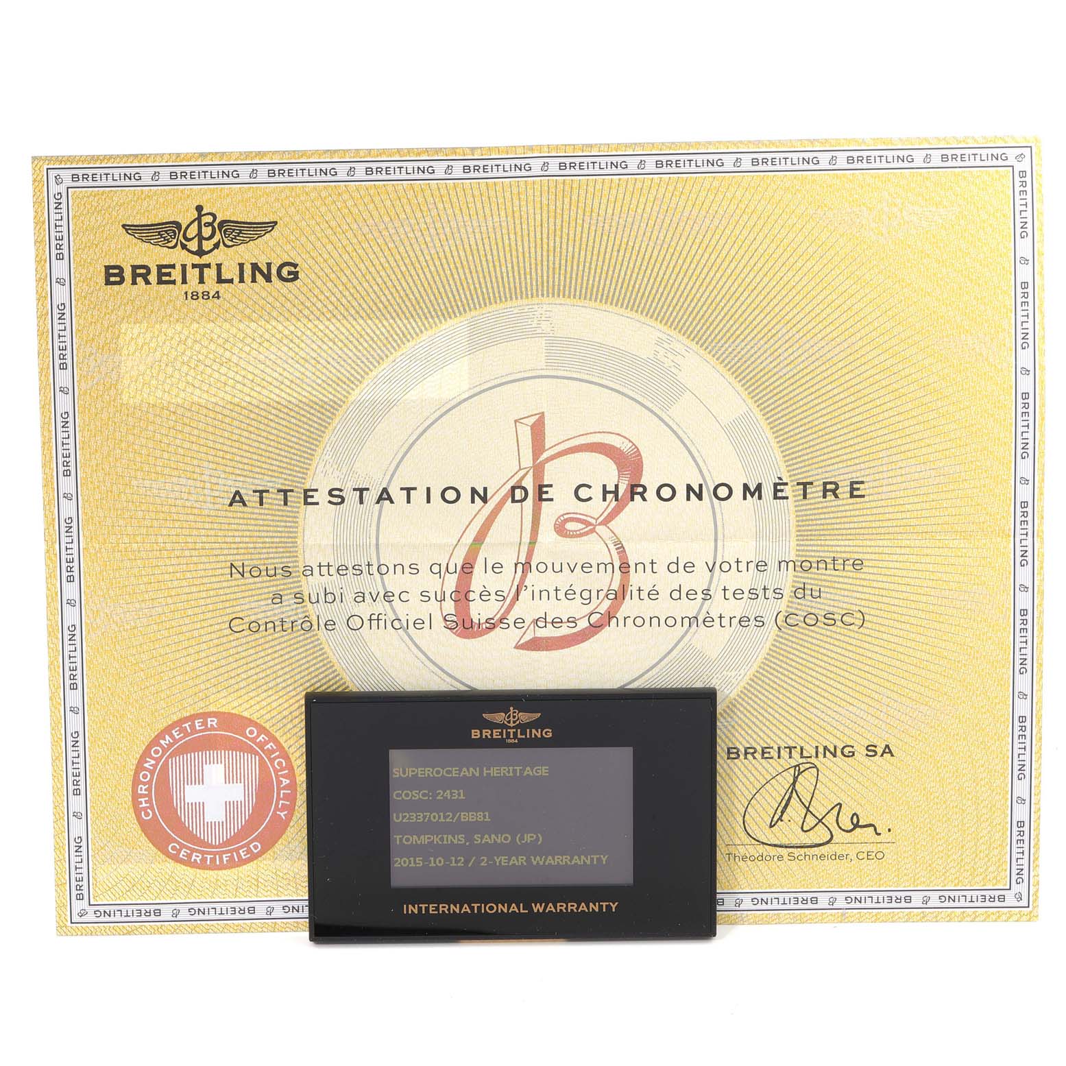 The image shows the warranty card and chronometer certificate for the Breitling Superocean U23370 Men
s Steel and Gold (two tone) Black Dial U23370 Men
s Steel and Gold (two tone) Black Dial model.