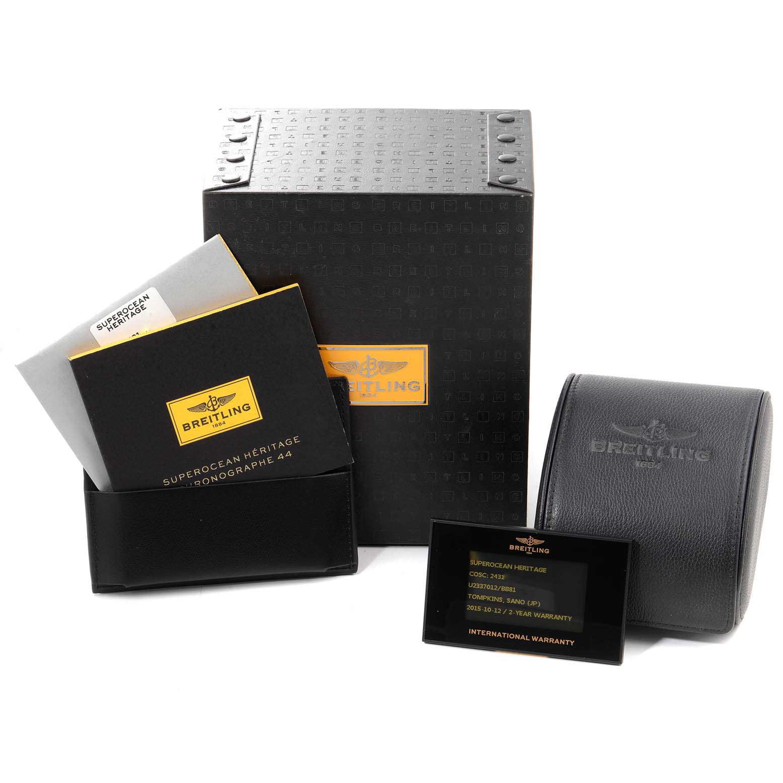 The image shows the packaging, user manuals, and warranty card for the Breitling Superocean U23370 Men
s Steel and Gold (two tone) Black Dial U23370 Men
s Steel and Gold (two tone) Black Dial watch model.