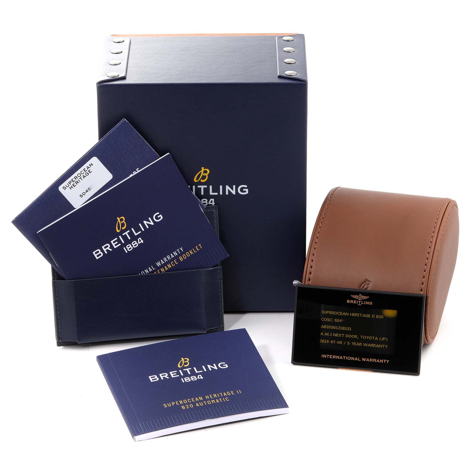 The image shows a Breitling Superocean AB2030 Men's Stainless Steel Black Dial AB2030 Men's Stainless Steel Black Dial watch box, booklets, a warranty card, and a leather travel case.