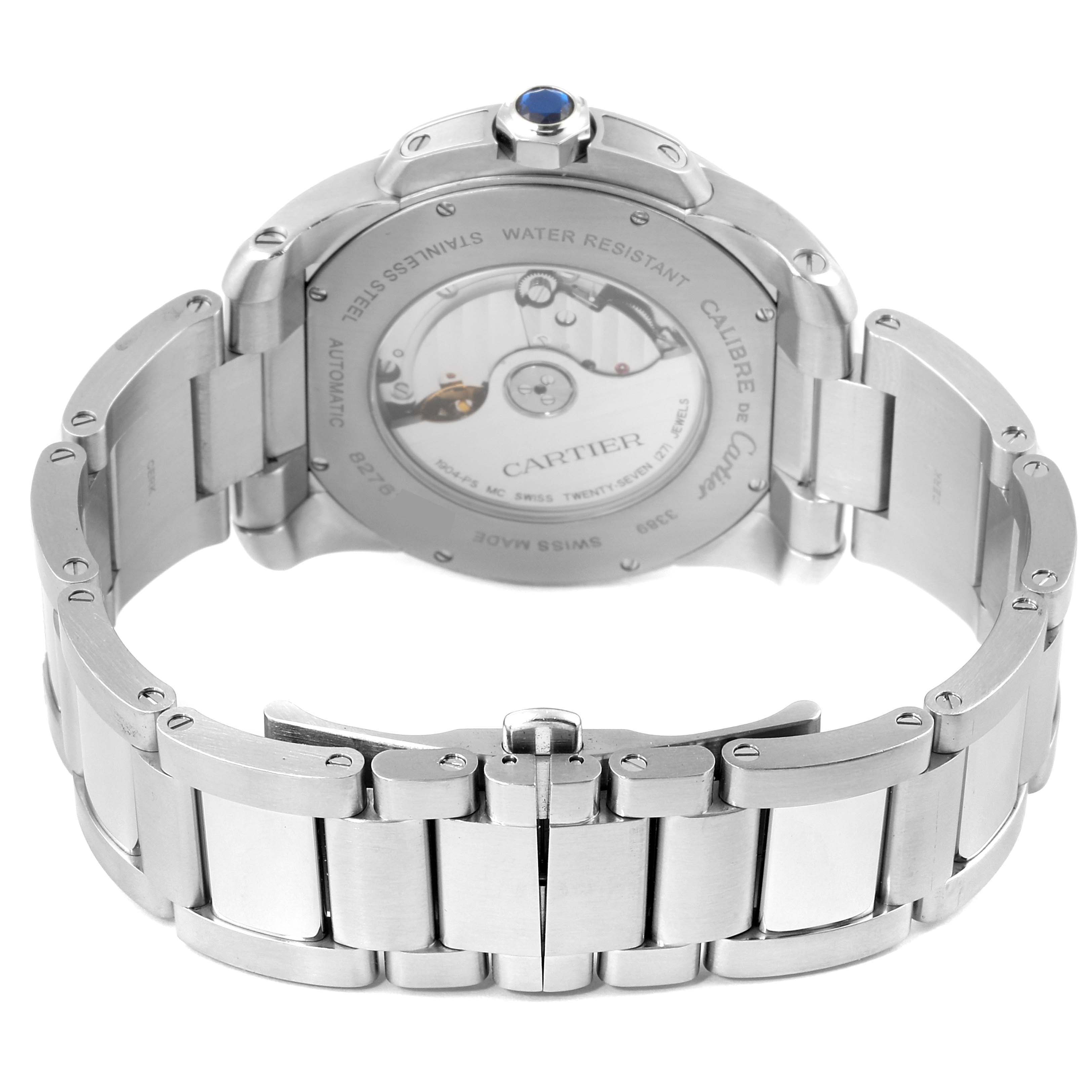 The image shows the back view of a Calibre de Cartier watch by Cartier, highlighting the stainless steel bracelet and movement.