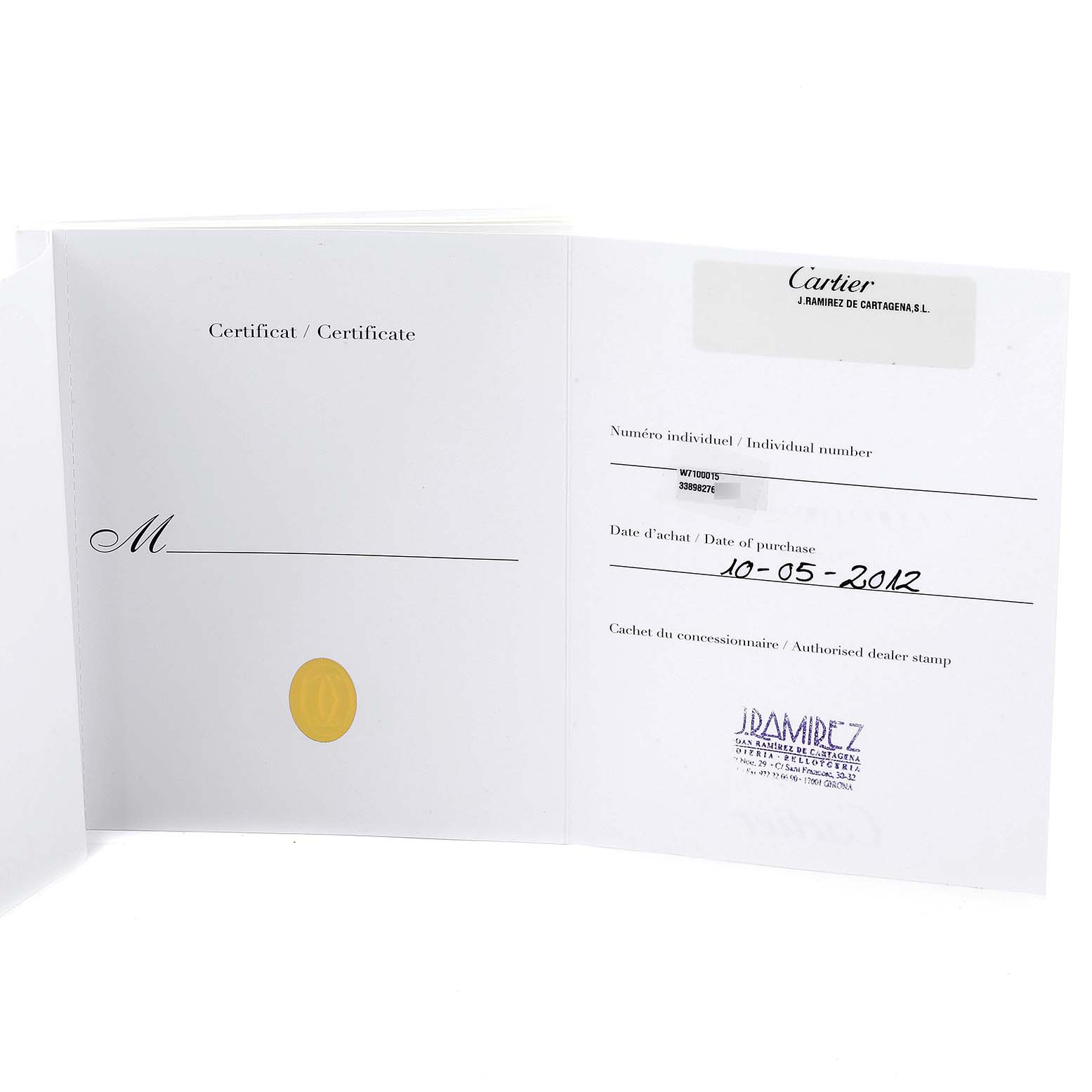 This image shows the opened certificate booklet for the Calibre de Cartier model by Cartier.