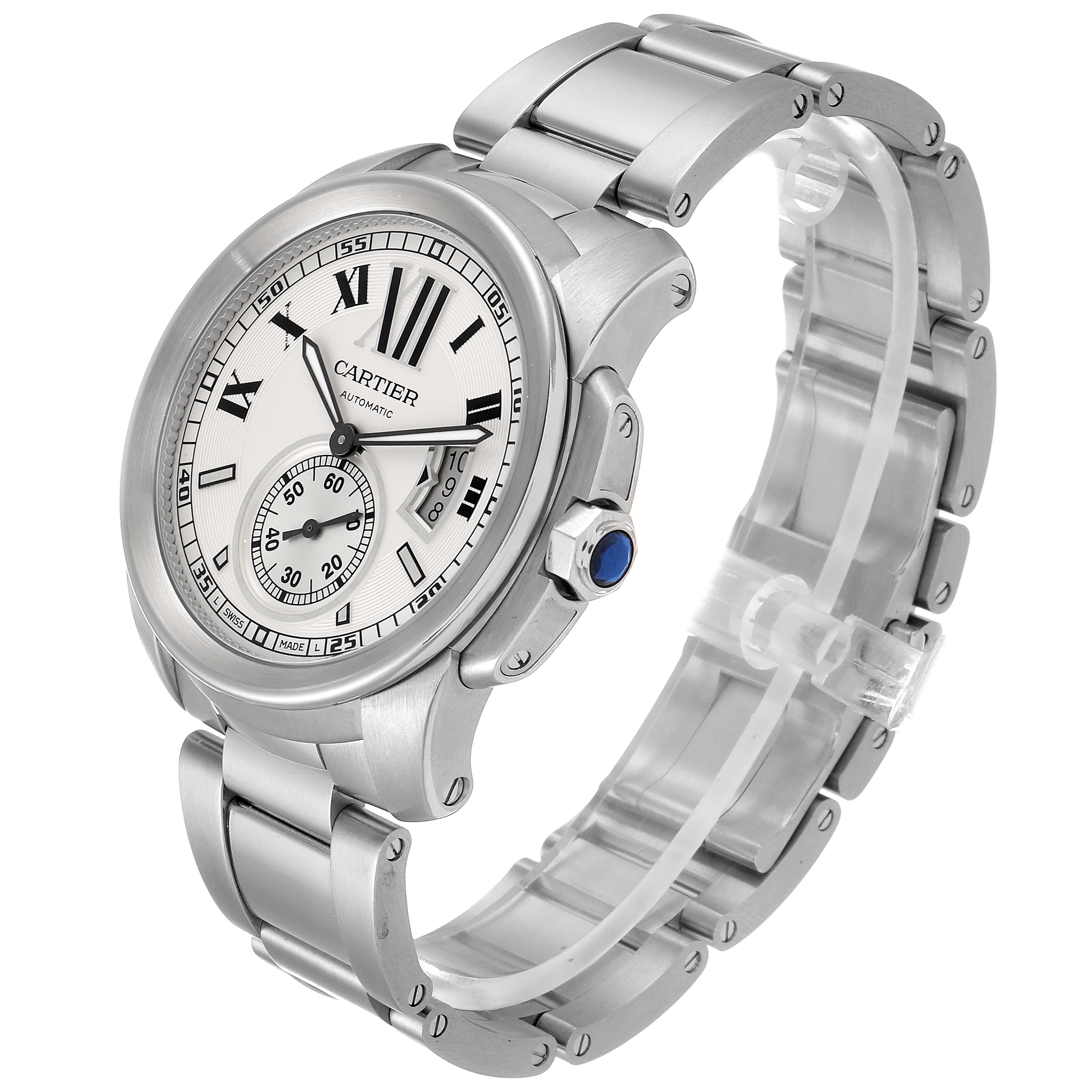 The image shows a Calibre de Cartier watch by Cartier from an angled side view, highlighting its dial, bezel, bracelet, and crown with blue cabochon.