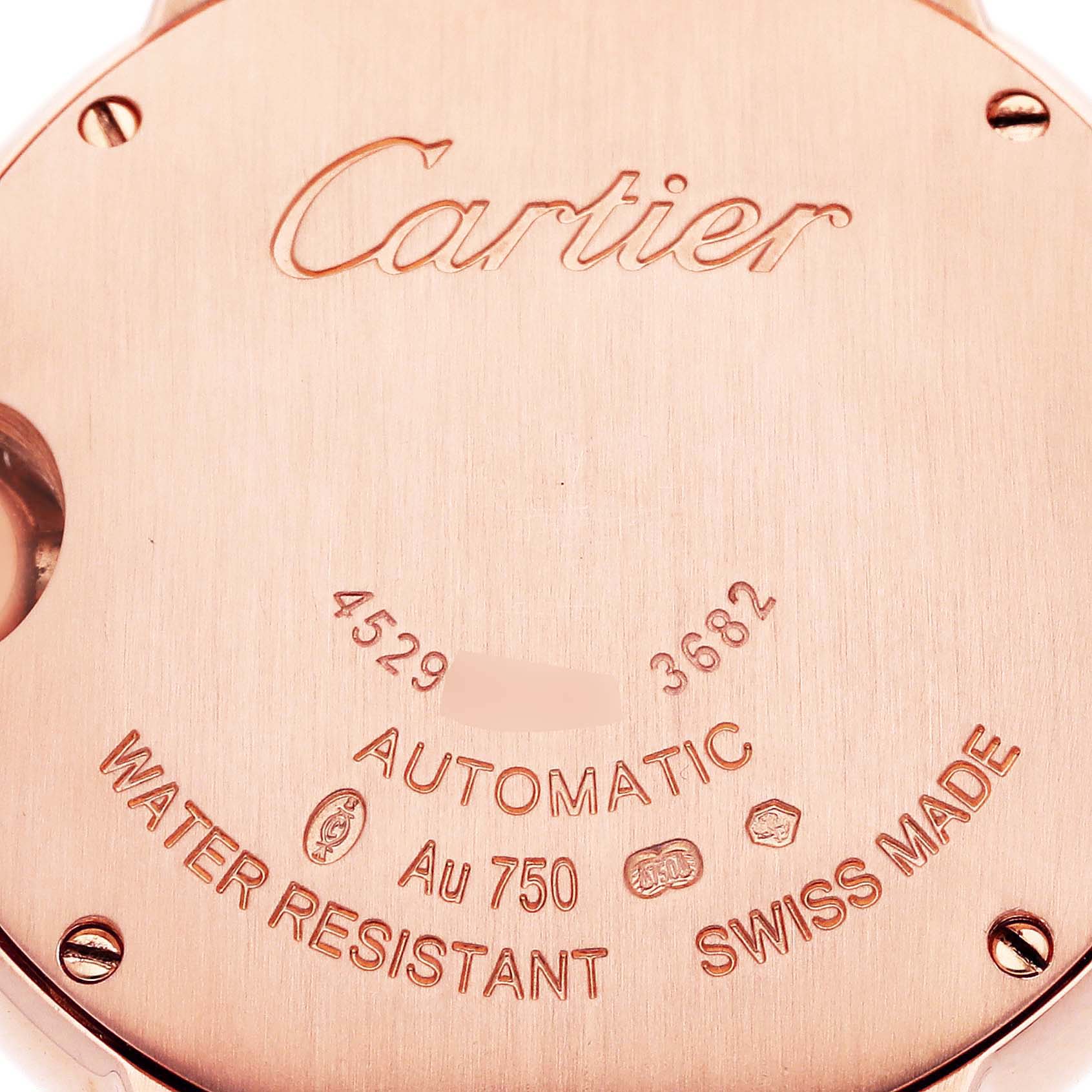 The image shows the back casing of a Cartier Ballon Bleu WE902064 Men
s Rose Gold Silver Dial WE902064 Men
s Rose Gold Silver Dial watch, featuring inscriptions and markings.