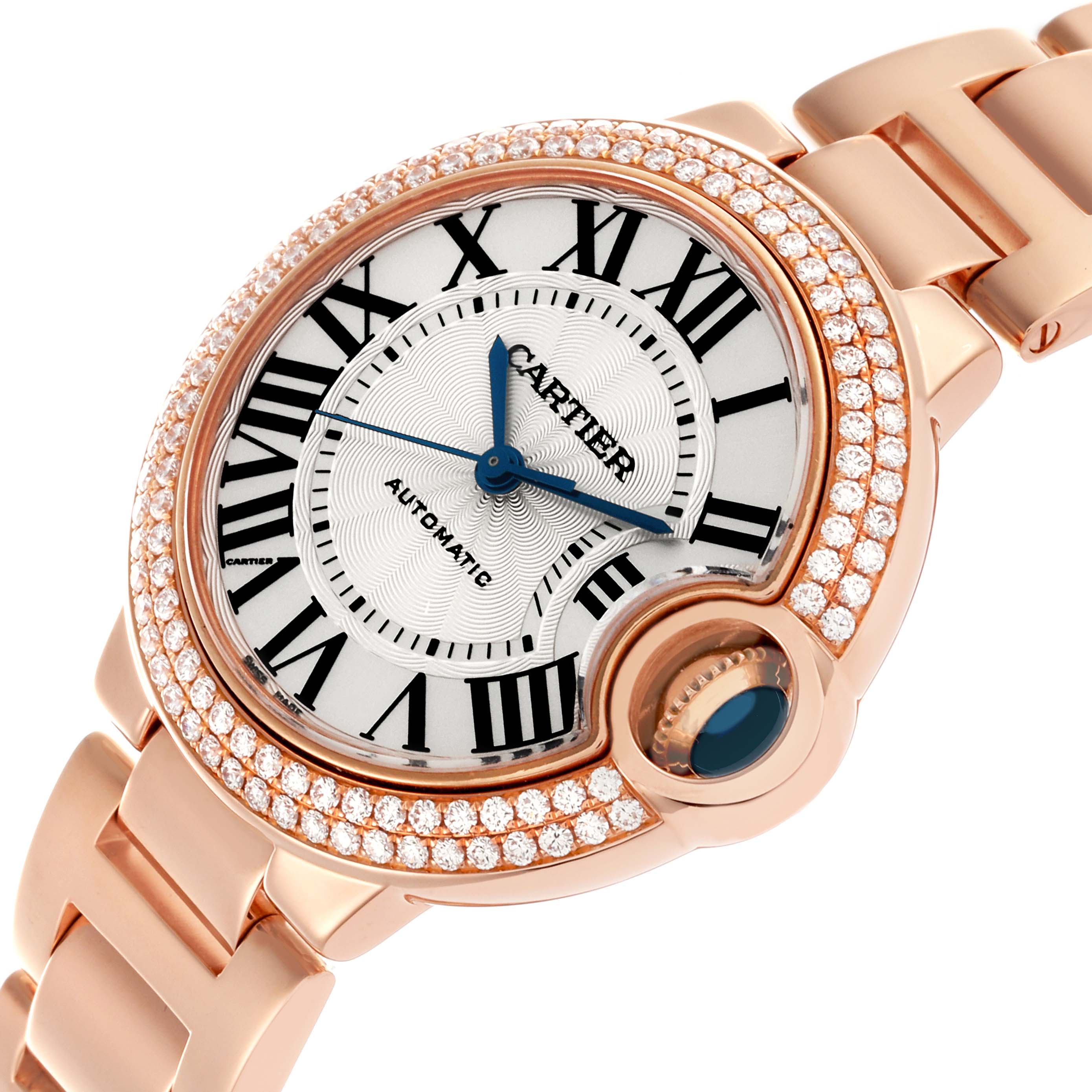 The Cartier Ballon Bleu WE902064 Men
s Rose Gold Silver Dial WE902064 Men
s Rose Gold Silver Dial watch is shown at a three-quarter angle, displaying the face, Roman numeral markers, and diamond-encrusted bezel.