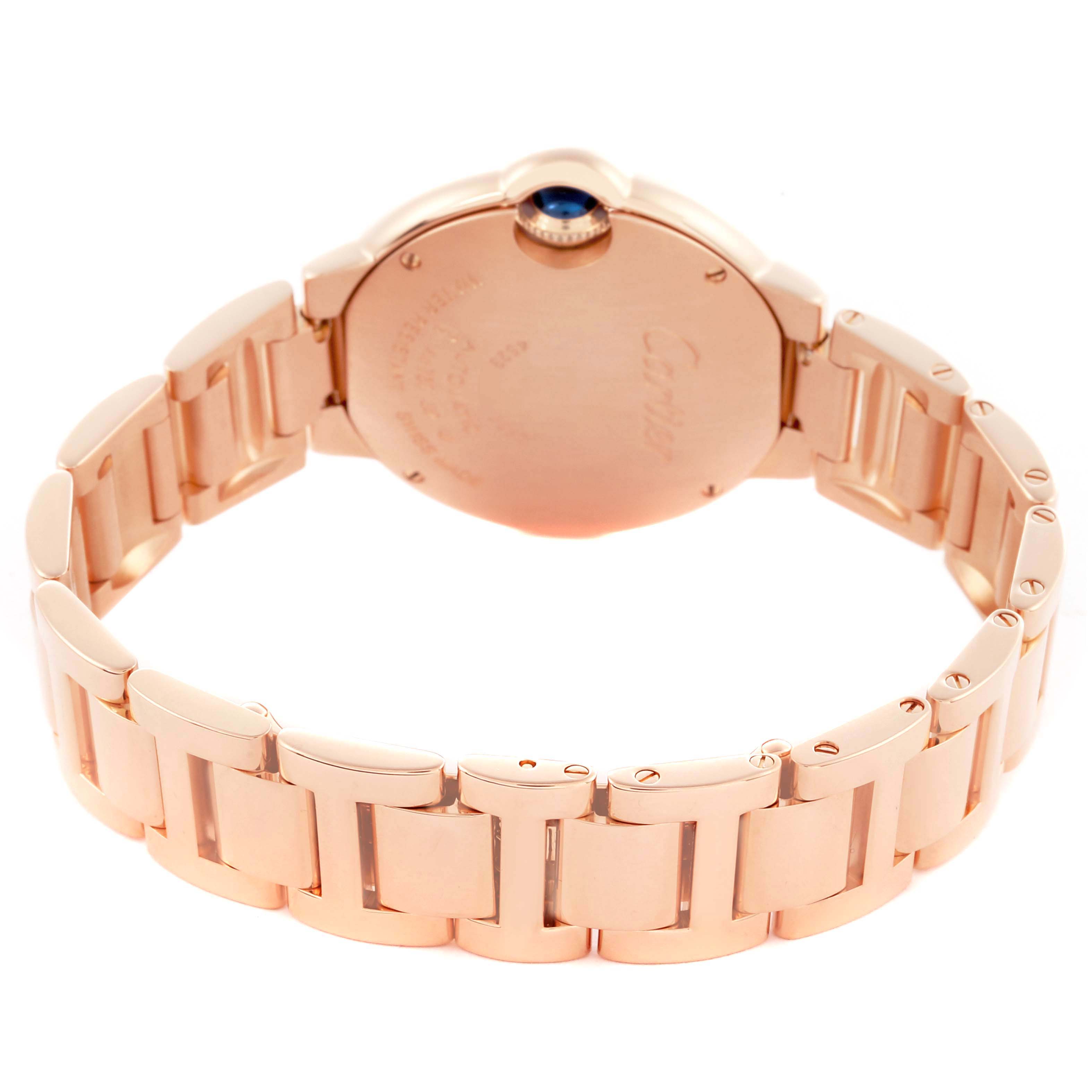 The Cartier Ballon Bleu WE902064 Men
s Rose Gold Silver Dial WE902064 Men
s Rose Gold Silver Dial watch is shown from the back, highlighting the gold bracelet and caseback.