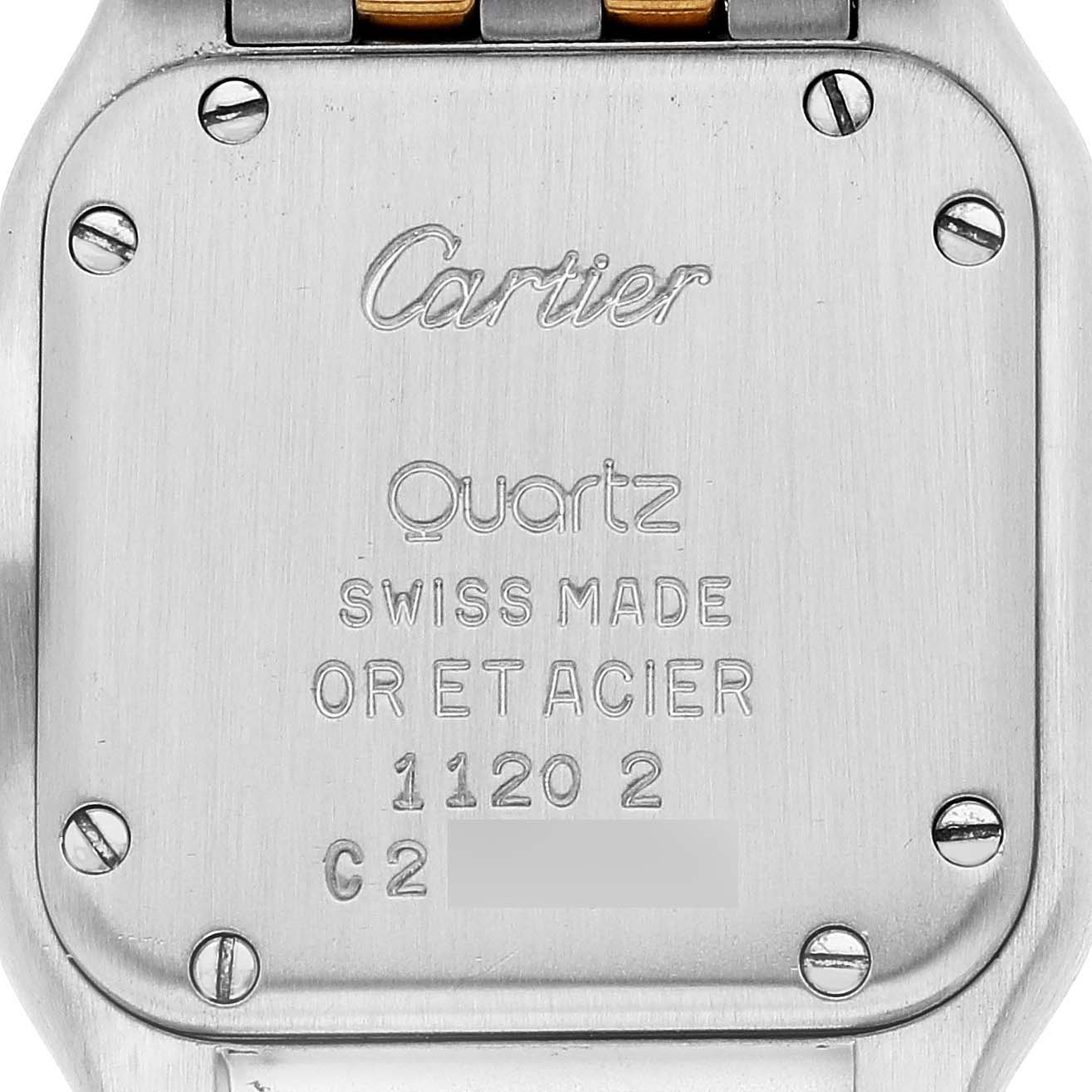The image shows the back case of a Cartier Panthere W25029B6 Women's Steel and Gold (two tone) Silver Dial W25029B6 Women's Steel and Gold (two tone) Silver Dial watch, highlighting its engravings and screws.