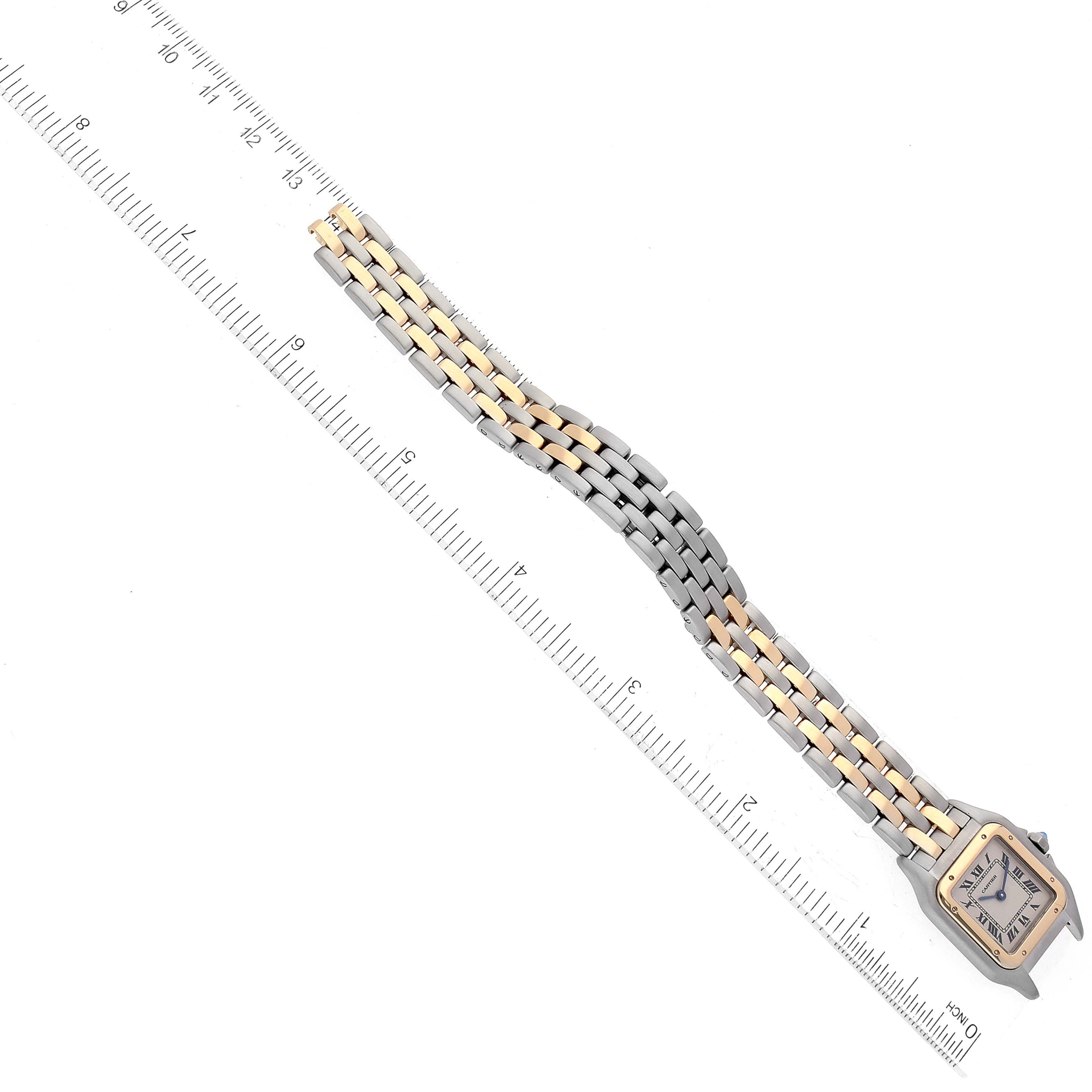 The image shows the front view of a Cartier Panthere W25029B6 Women's Steel and Gold (two tone) Silver Dial W25029B6 Women's Steel and Gold (two tone) Silver Dial watch, displaying its case, dial, and two-tone metal bracelet against a ruler.