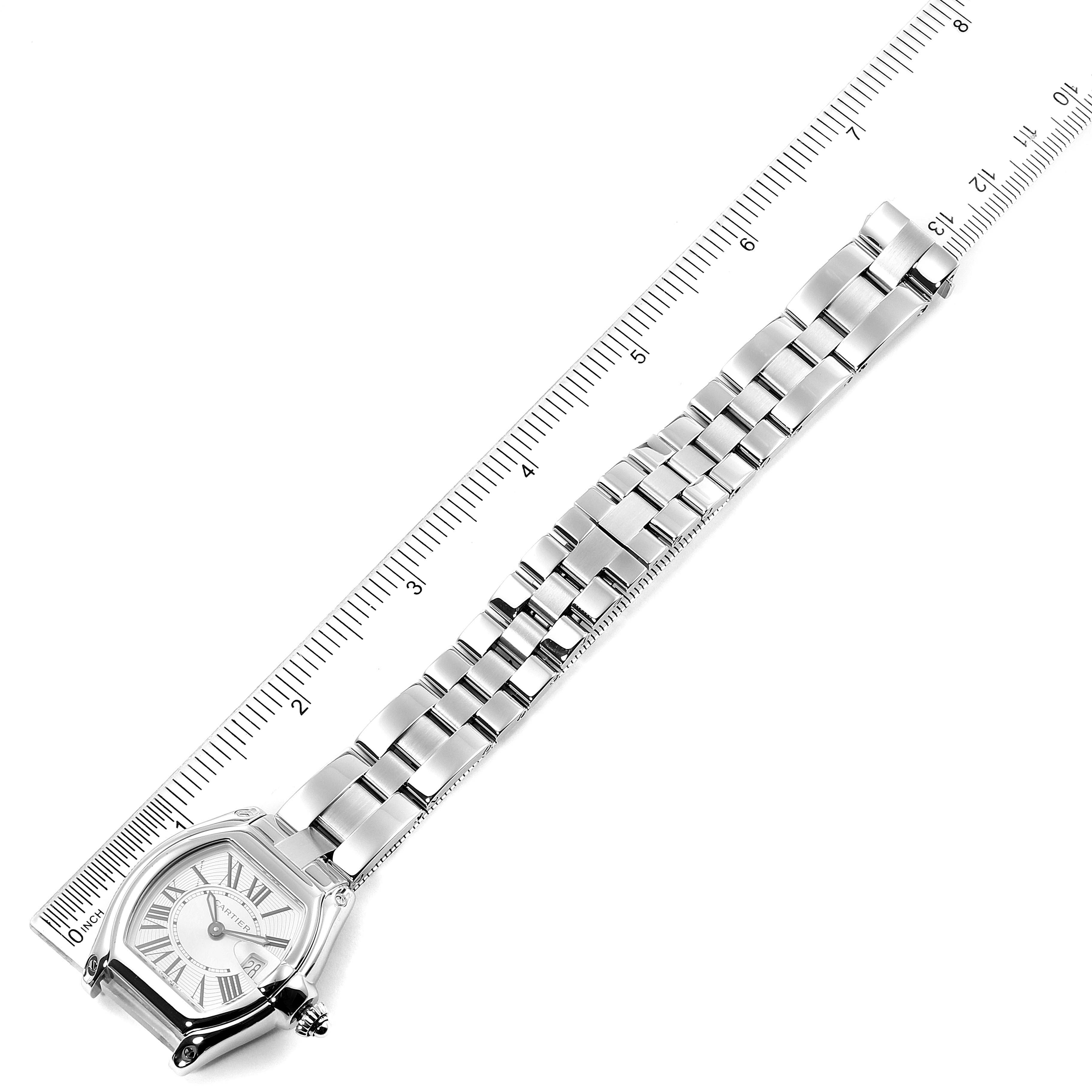 The image shows a Cartier Roadster W62016V3 Women's Stainless Steel Silver Dial W62016V3 Women's Stainless Steel Silver Dial watch laid flat, with its face and stainless steel bracelet visible, alongside a ruler for measurement.