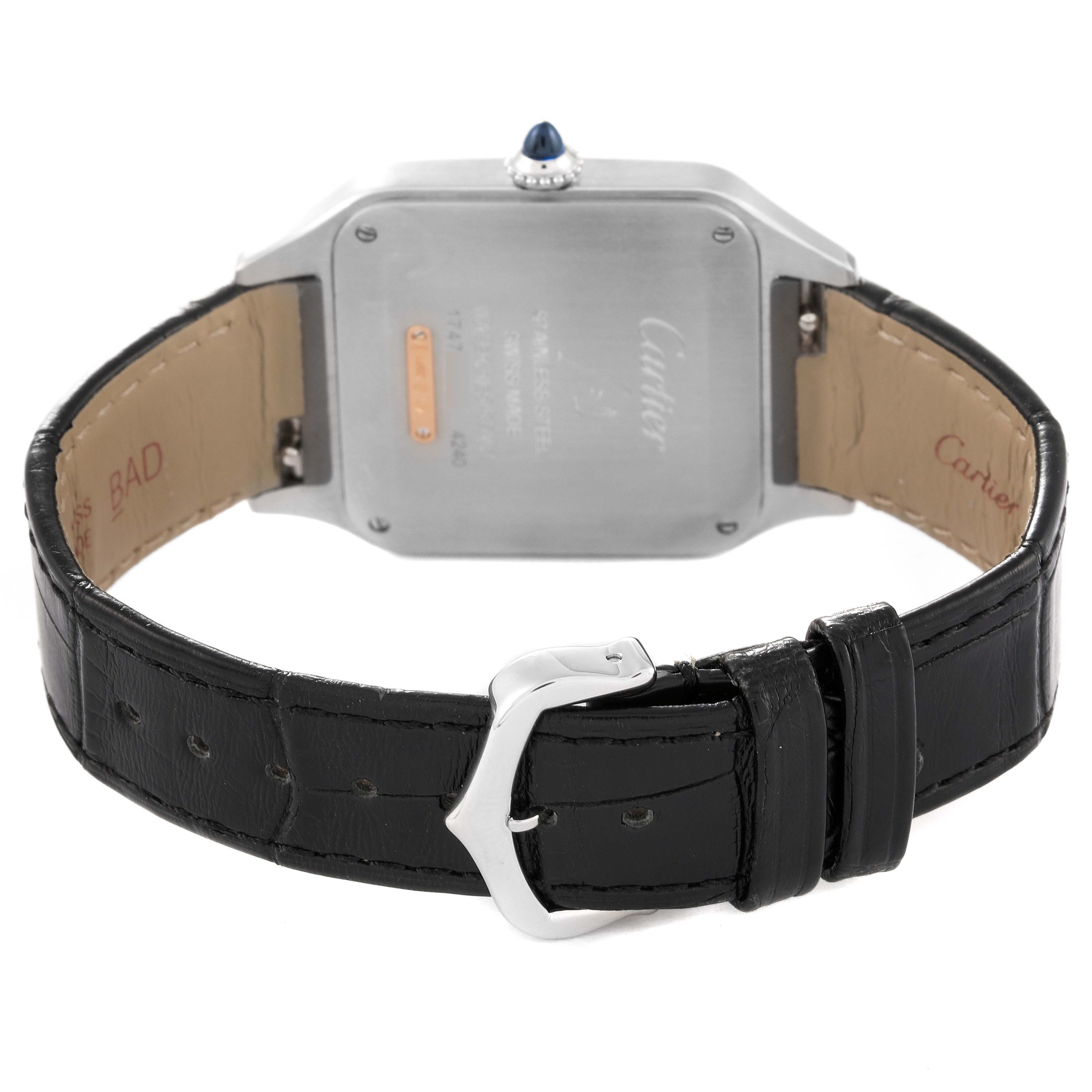 The image shows the back view of a Cartier Santos Dumont W2SA0011 Men's Steel and Gold (two tone) Silver Dial W2SA0011 Men's Steel and Gold (two tone) Silver Dial watch, highlighting the watch case, crown, and black leather strap.