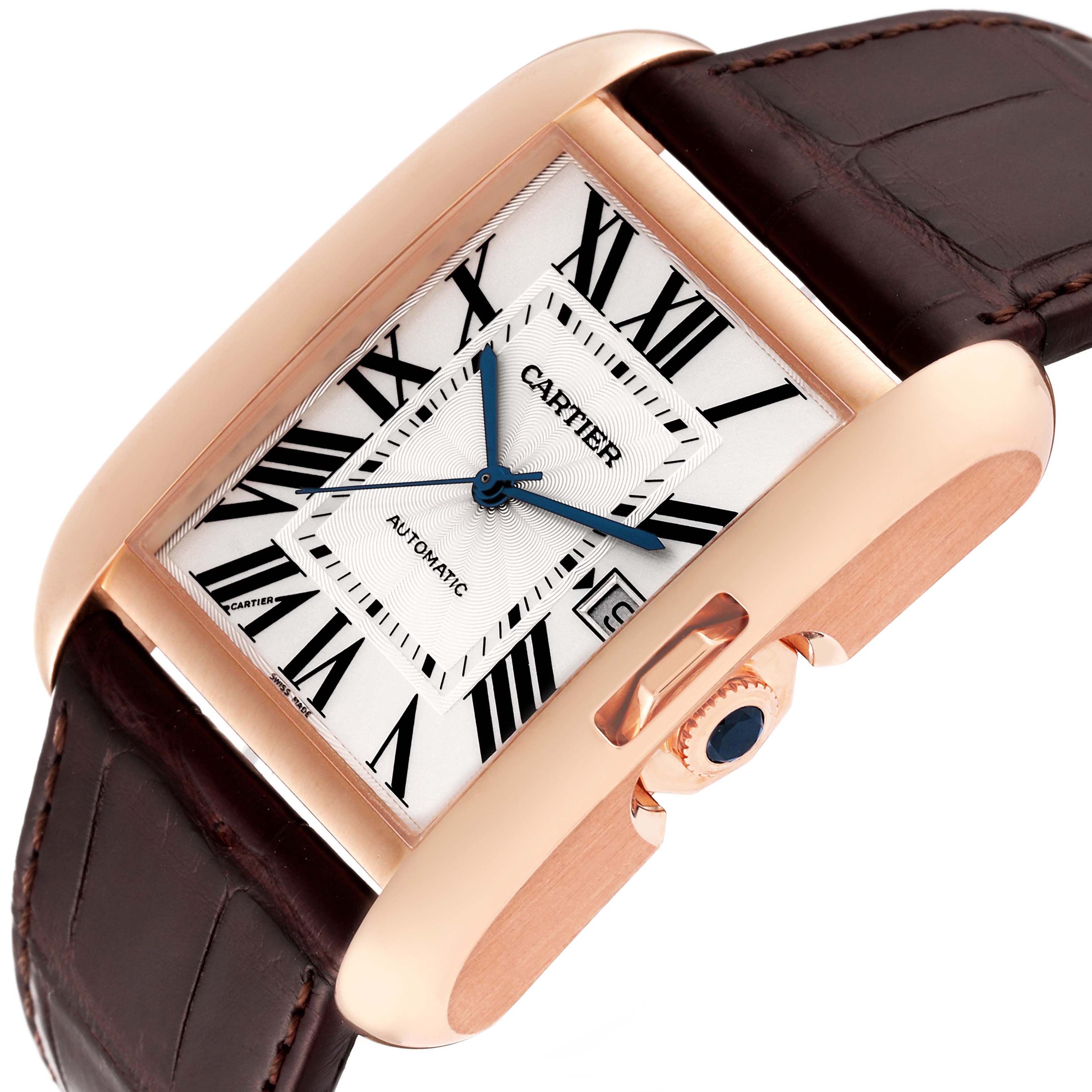 The Cartier Tank Anglaise W5310004 Men's Rose Gold Silver Dial W5310004 Men's Rose Gold Silver Dial watch is shown at an angle highlighting its face, roman numerals, crown, and part of the leather strap.