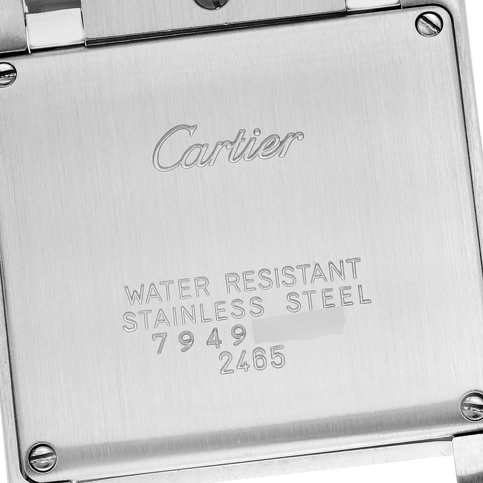 This image shows the back casing of a Tank Francaise Cartier watch with engraved details.