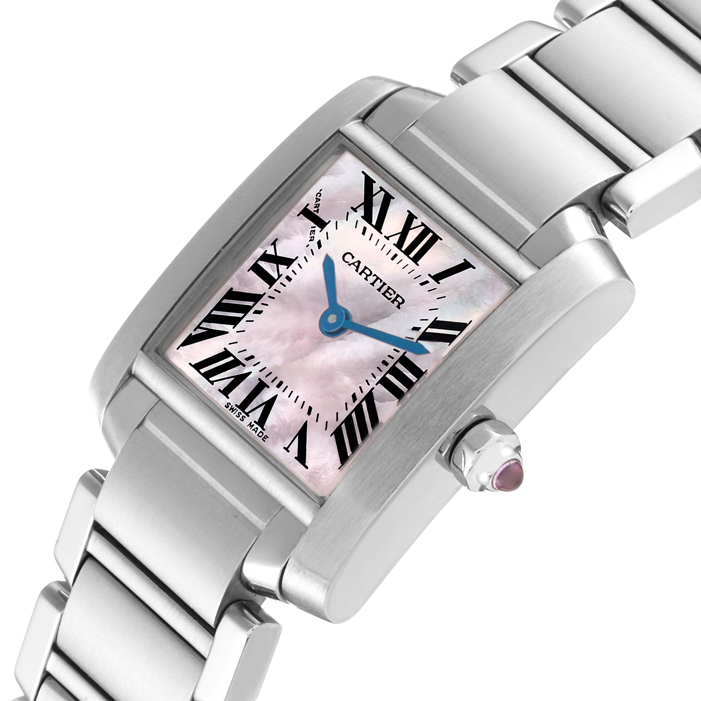 The Tank Française by Cartier is shown at an oblique angle, highlighting the pink mother-of-pearl dial, Roman numerals, and stainless steel bracelet.