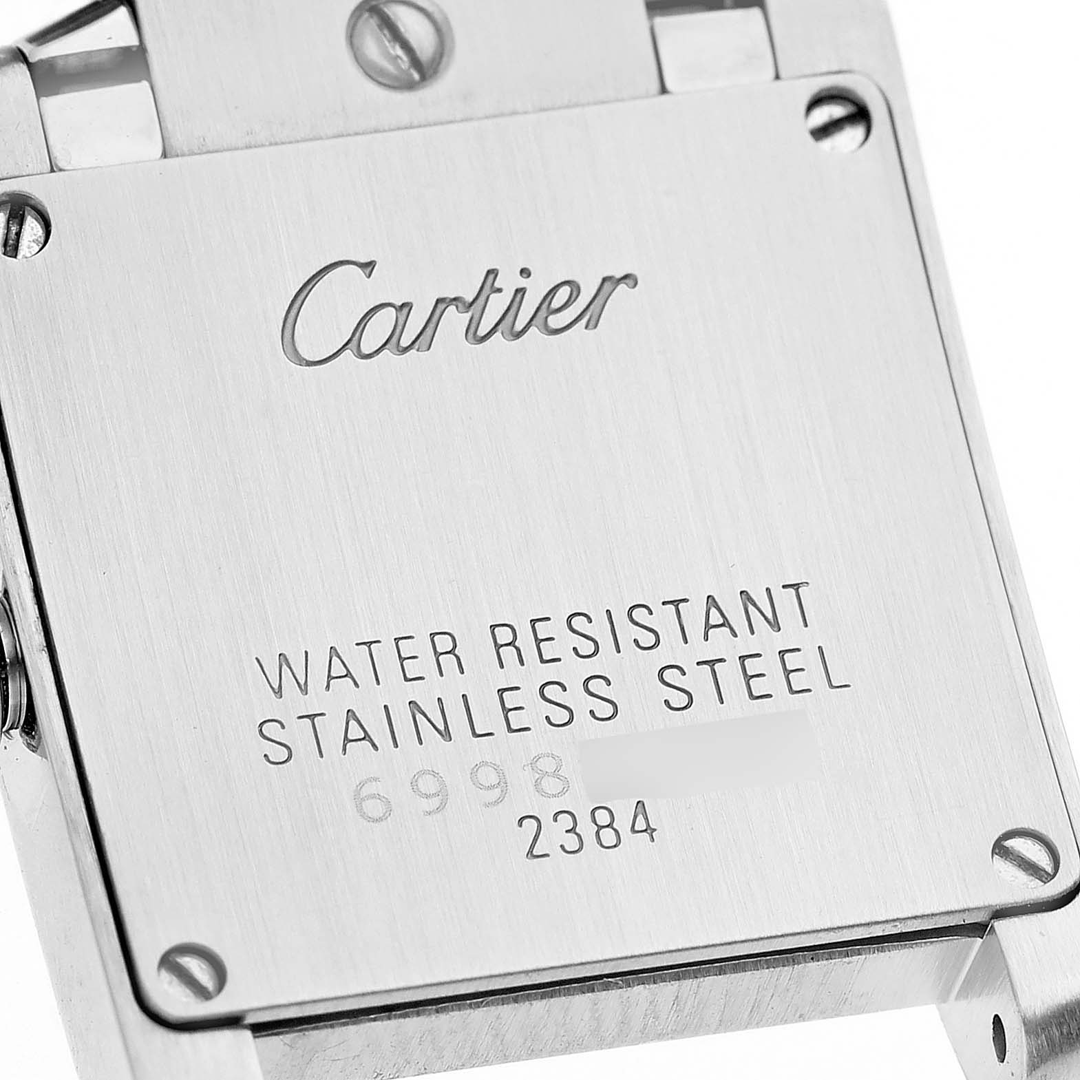The image shows the back casing of a Cartier Tank Francaise W51028Q3 Women's Stainless Steel Mother of Pearl Dial W51028Q3 Women's Stainless Steel Mother of Pearl Dial watch, featuring water resistance and stainless steel markings.