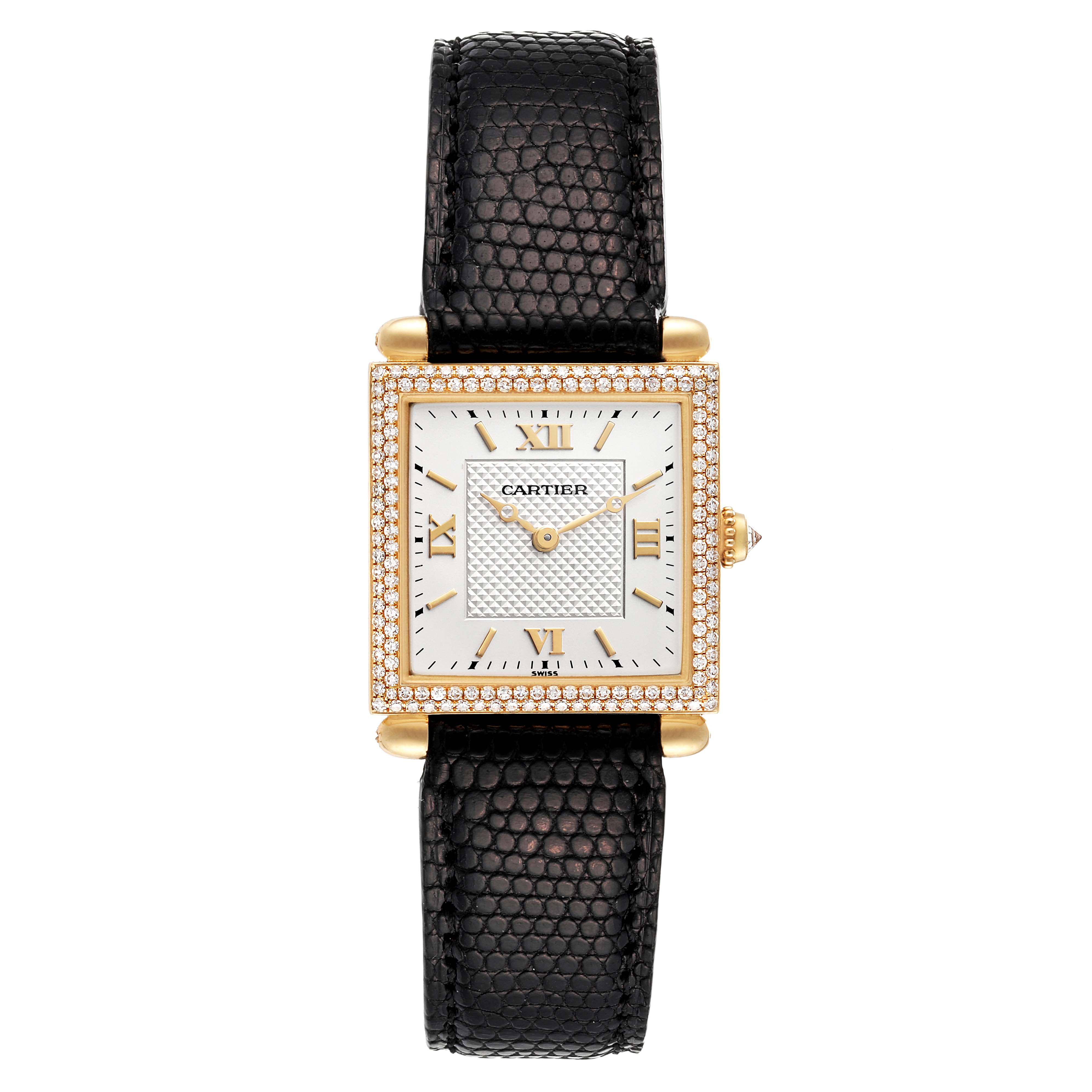 The image shows a front view of the Cartier Tank Obus WB800351 Women
s Yellow Gold Silver Dial WB800351 Women
s Yellow Gold Silver Dial watch, featuring a black strap and a diamond-studded square face.