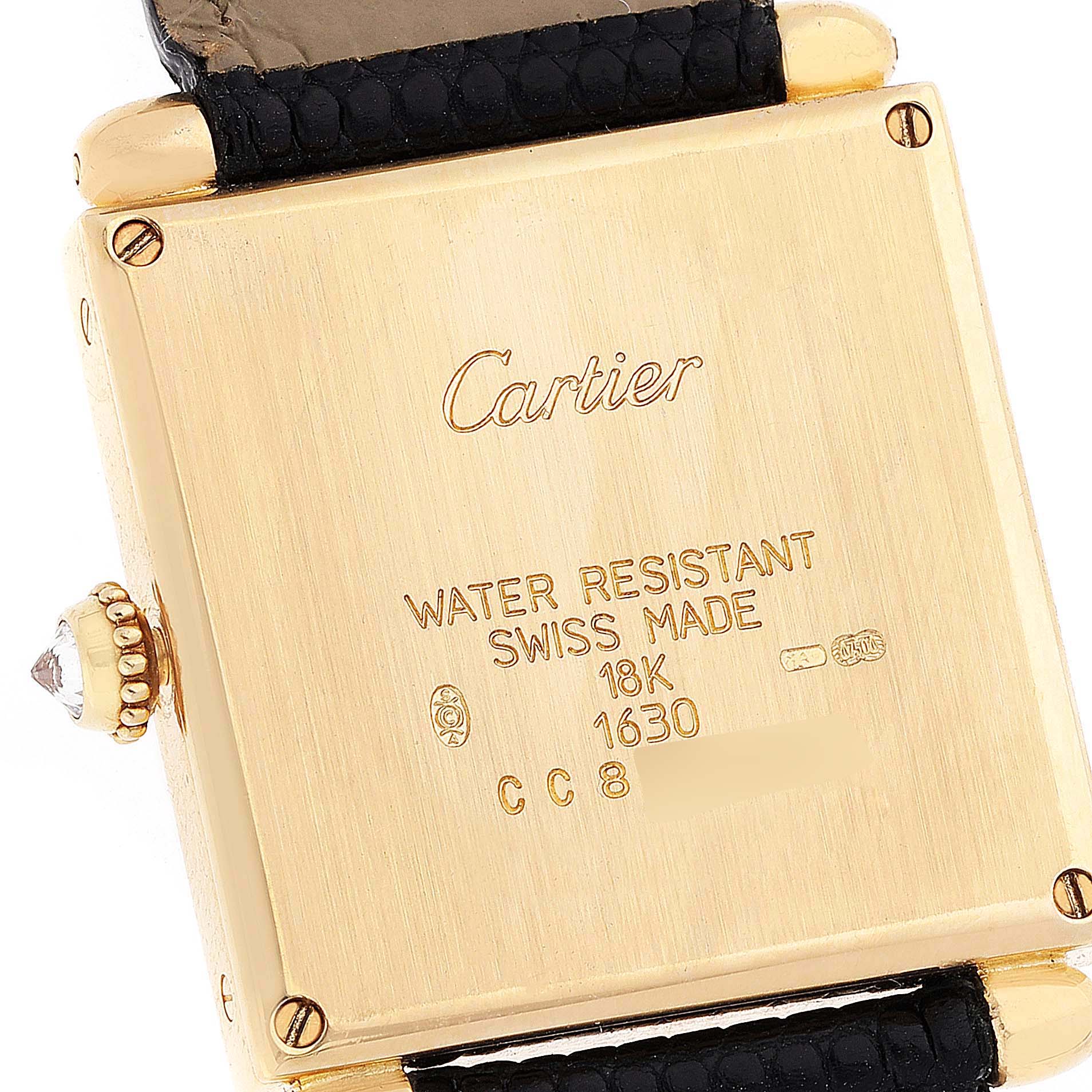 This image shows the back case of a Tank Obus watch by Cartier, including details about its water resistance, materials, and the strap attachment.